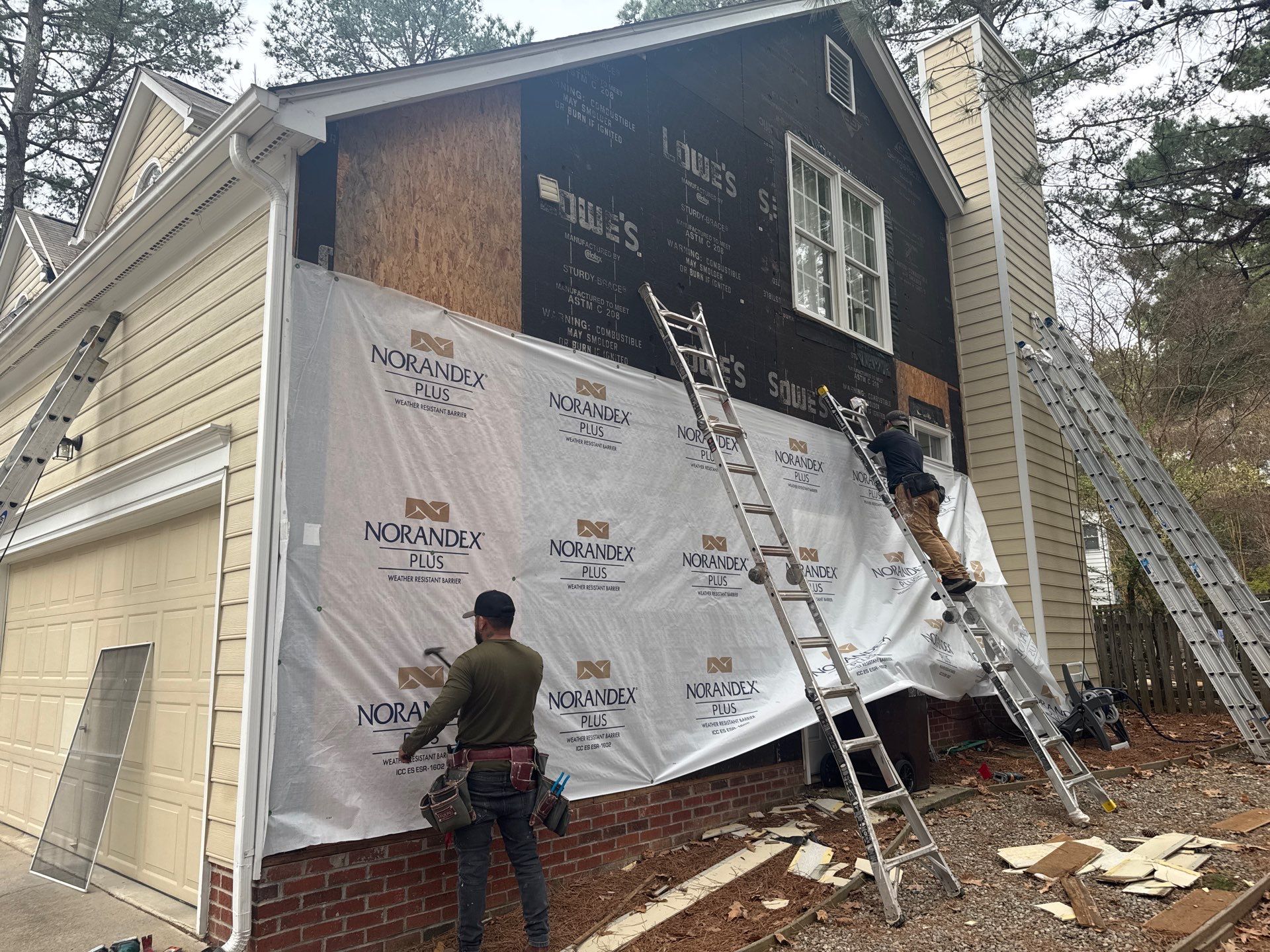 Exterior paint and siding replacement by GonzalezPainters & Contractors Inc 