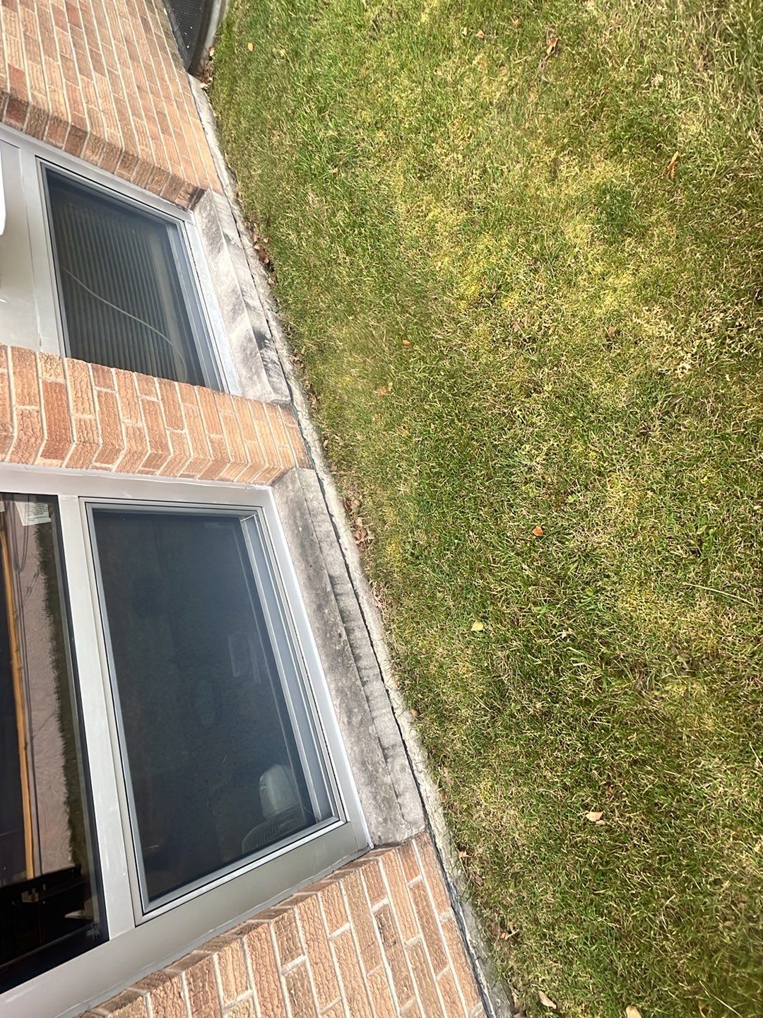 Commercial brick exterior cleaning by Northern Power Washing LLC.