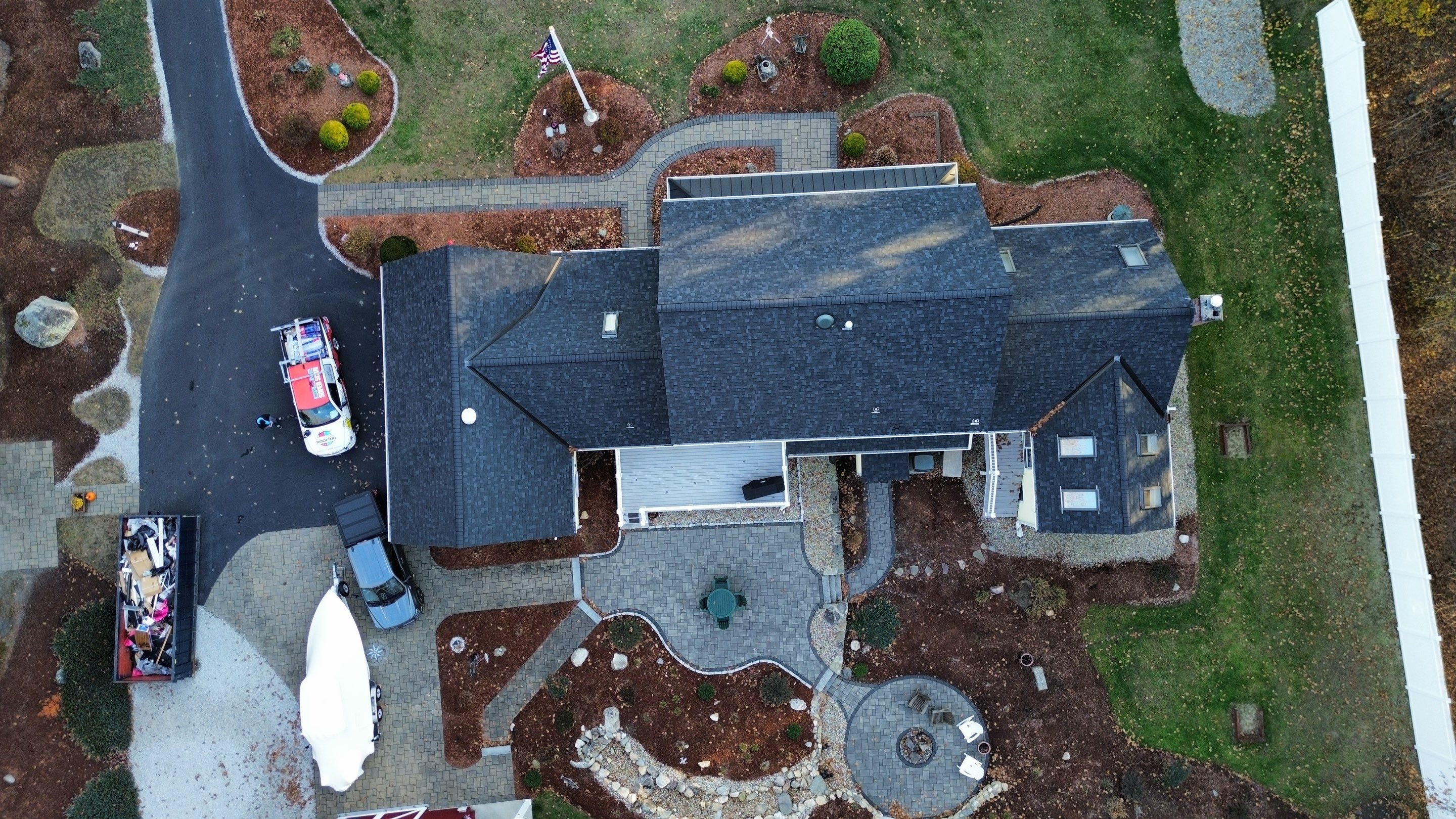 Chelmsford Premium Roof: Onyx Black Shingles with Standing Seam Metal Porch by Mighty Dog Roofing of Greater Middlesex County