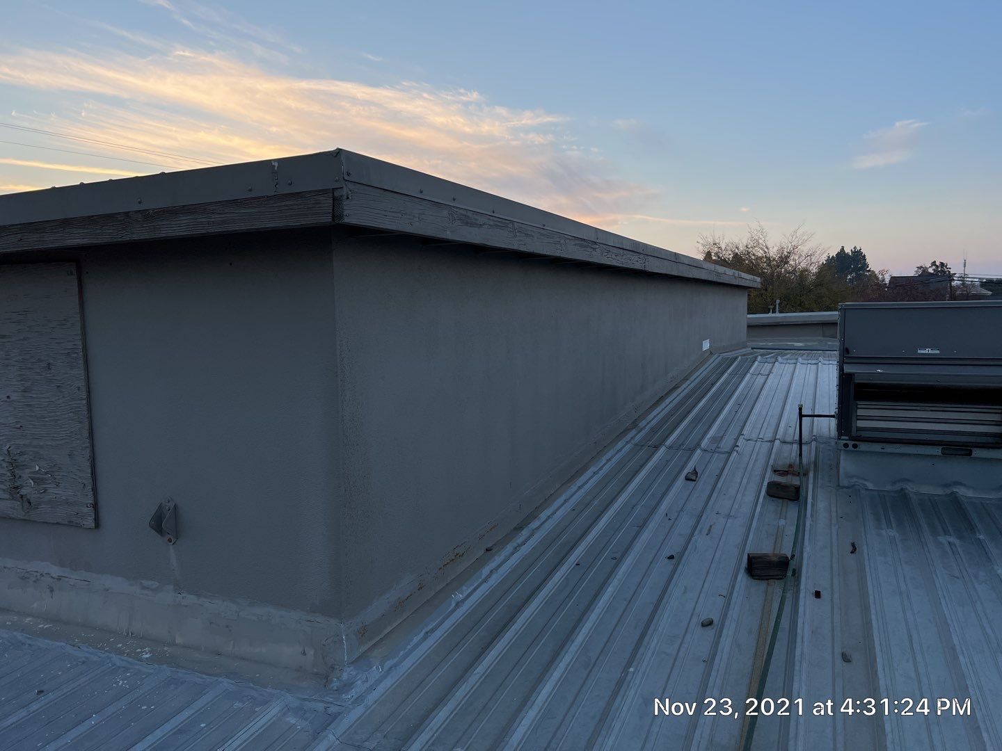 Metal roof restoration on commercial roof using Conklin Benchmark/ PUMA XL acrylic coatings over metal and foam by Straight Edge Roofing Inc