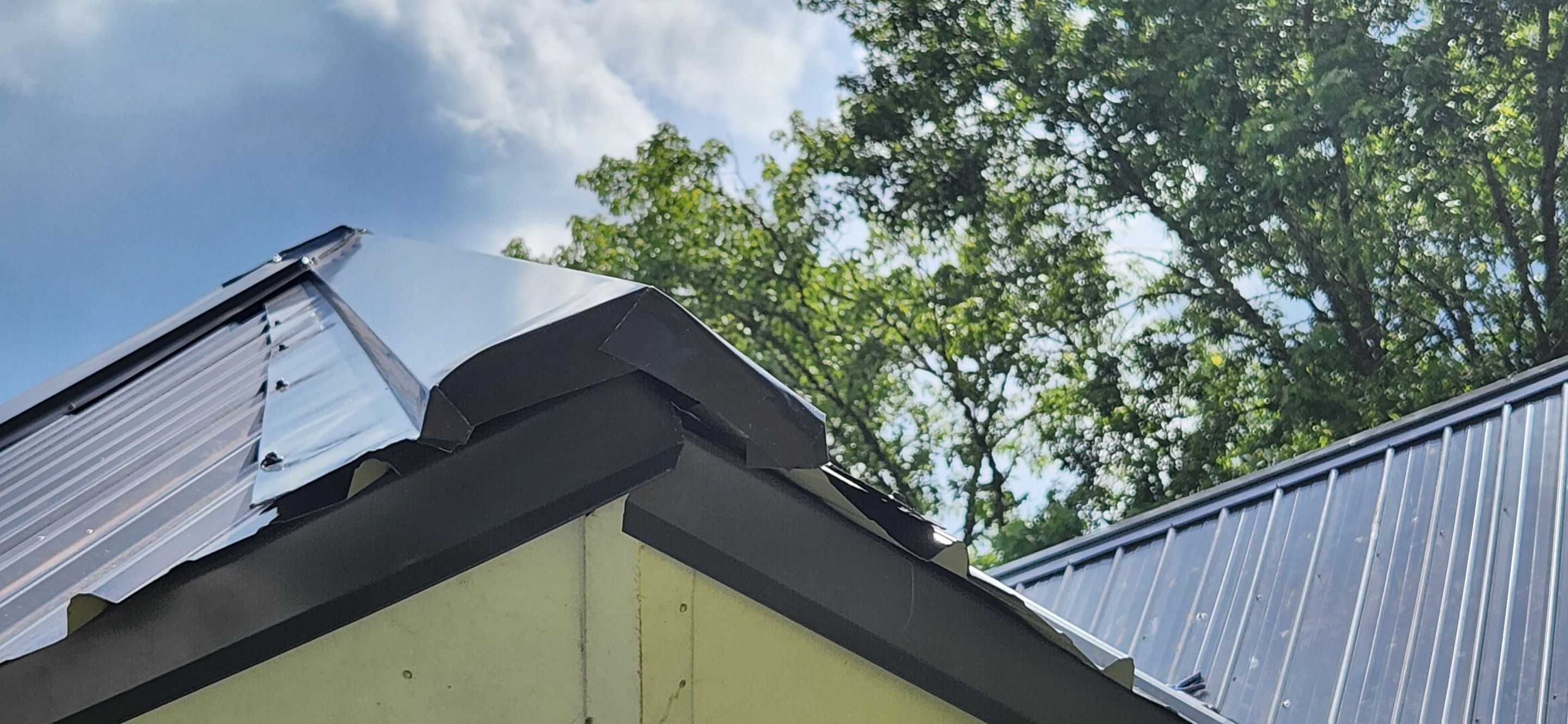 Residential Roofing Installation using 26 Gauge Colored Panels by Hostetler Roofing