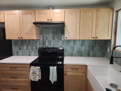 Vancouver Kitchen Renovation Featuring Tile Backsplash and Farmhouse Sink