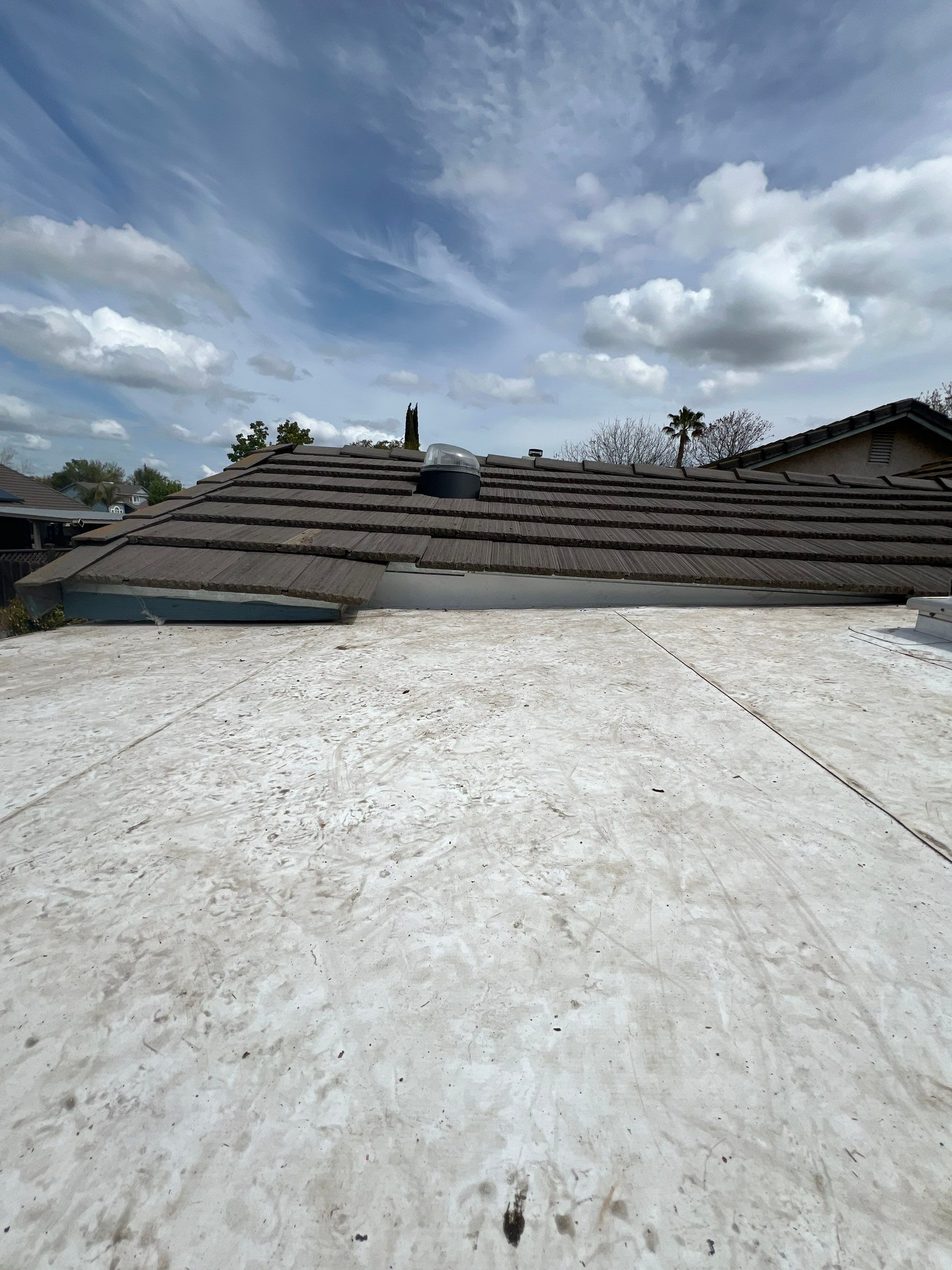 Single-ply roofing system on porch using TPO 60 mil by Straight Edge Roofing Inc