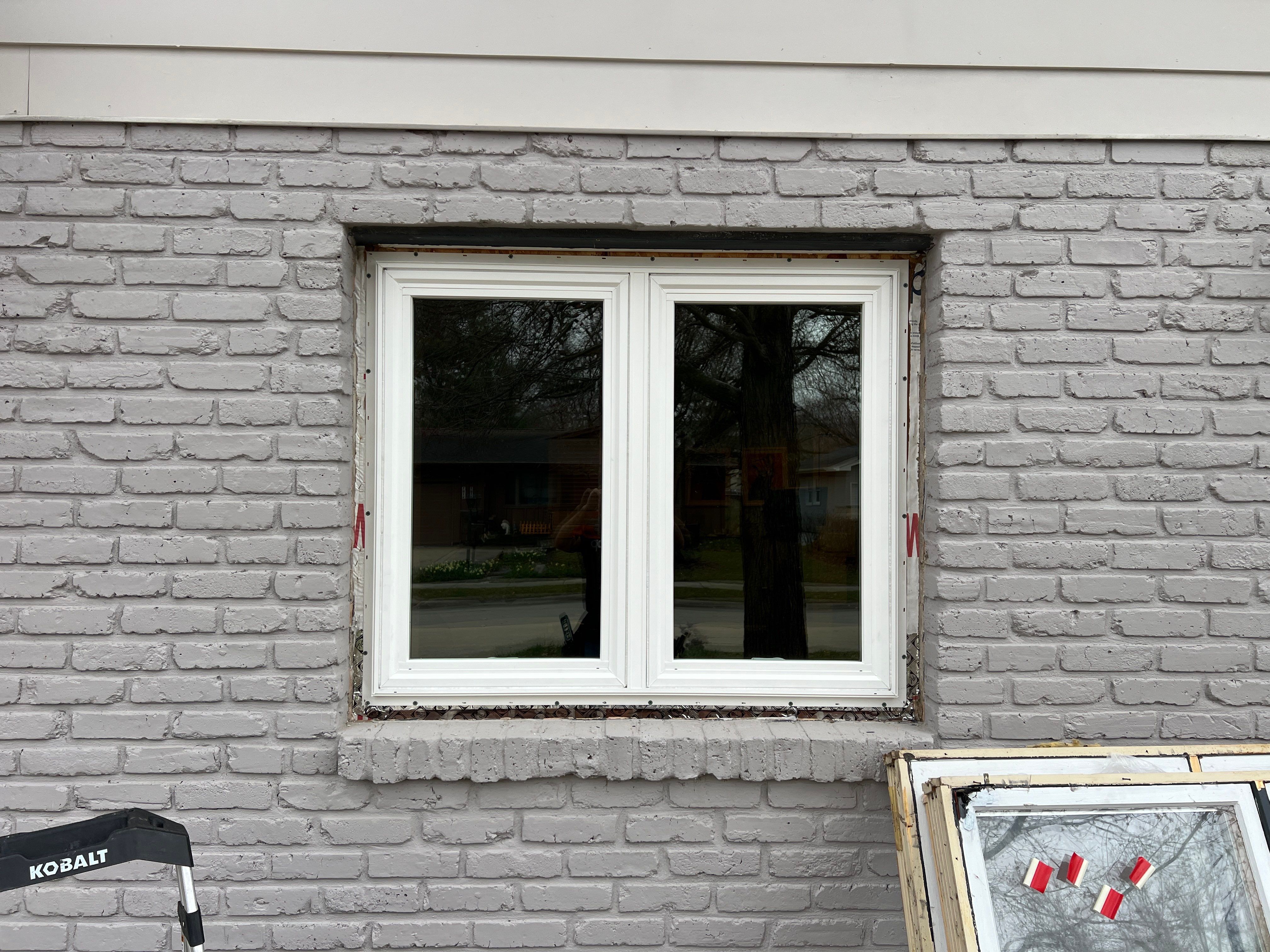 Window Installation using Pella 250 series vinyl window by United Windows and Siding LLC