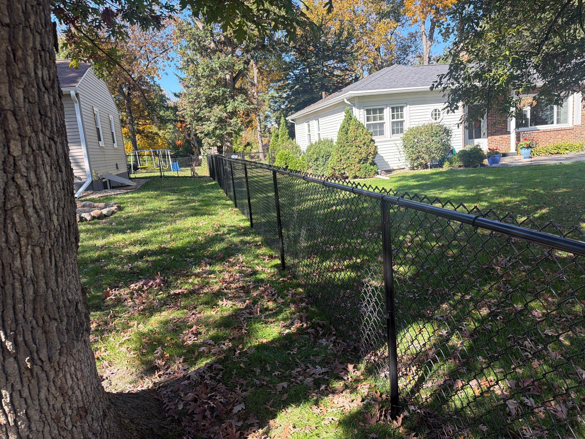 Residential Black Chain Link Fencing in Cedar Falls by Perfect Picket Fence and Stain