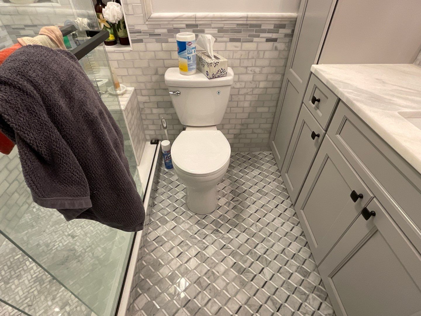 Bathroom Remodel using Two new bathroom design and new floors by Alpha Design Services