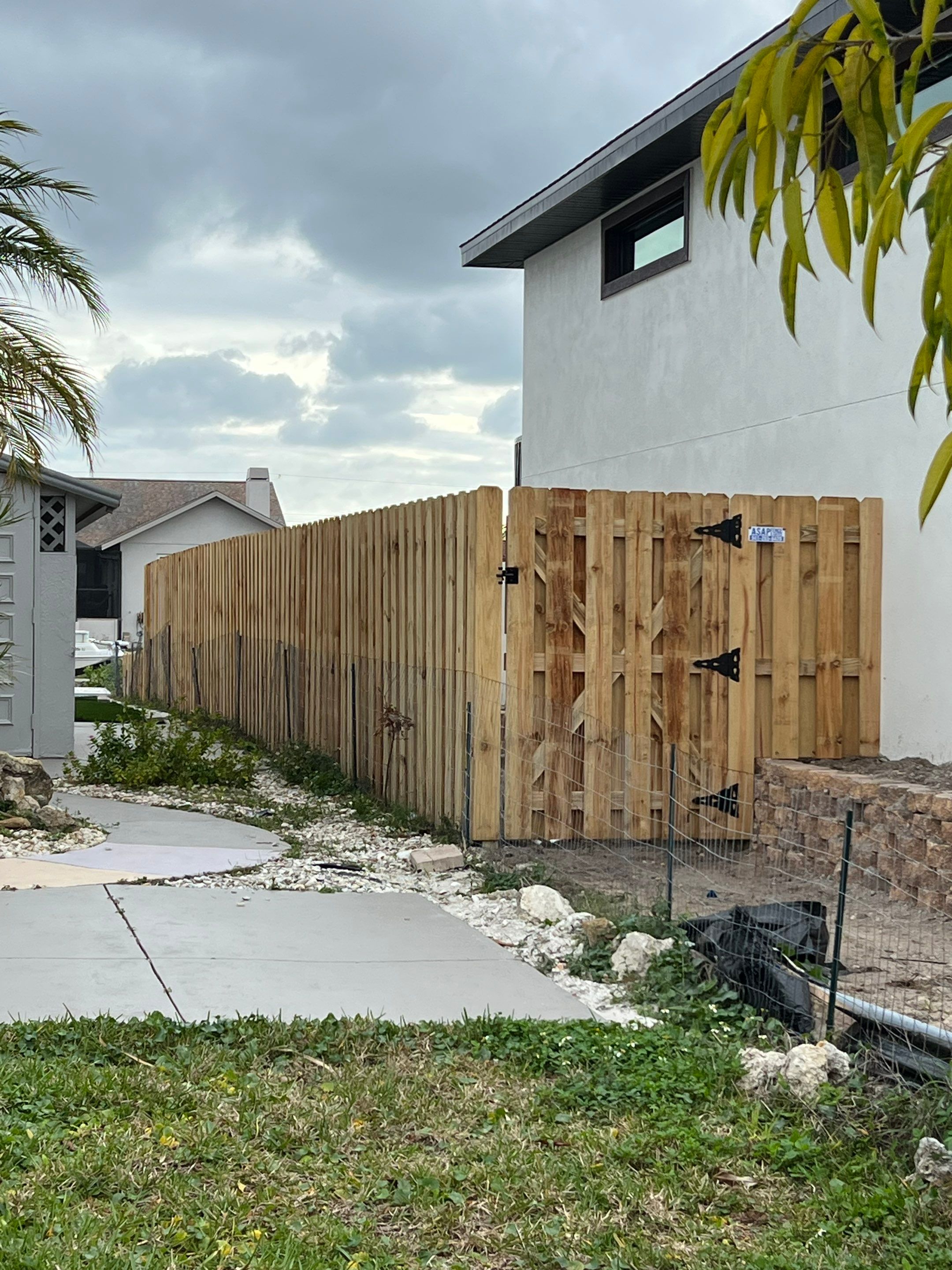 Wood Fence Installation using 6Ft Tall Pressure Treated Wood Shadowbox Fence by Asap fence and gates, LLC