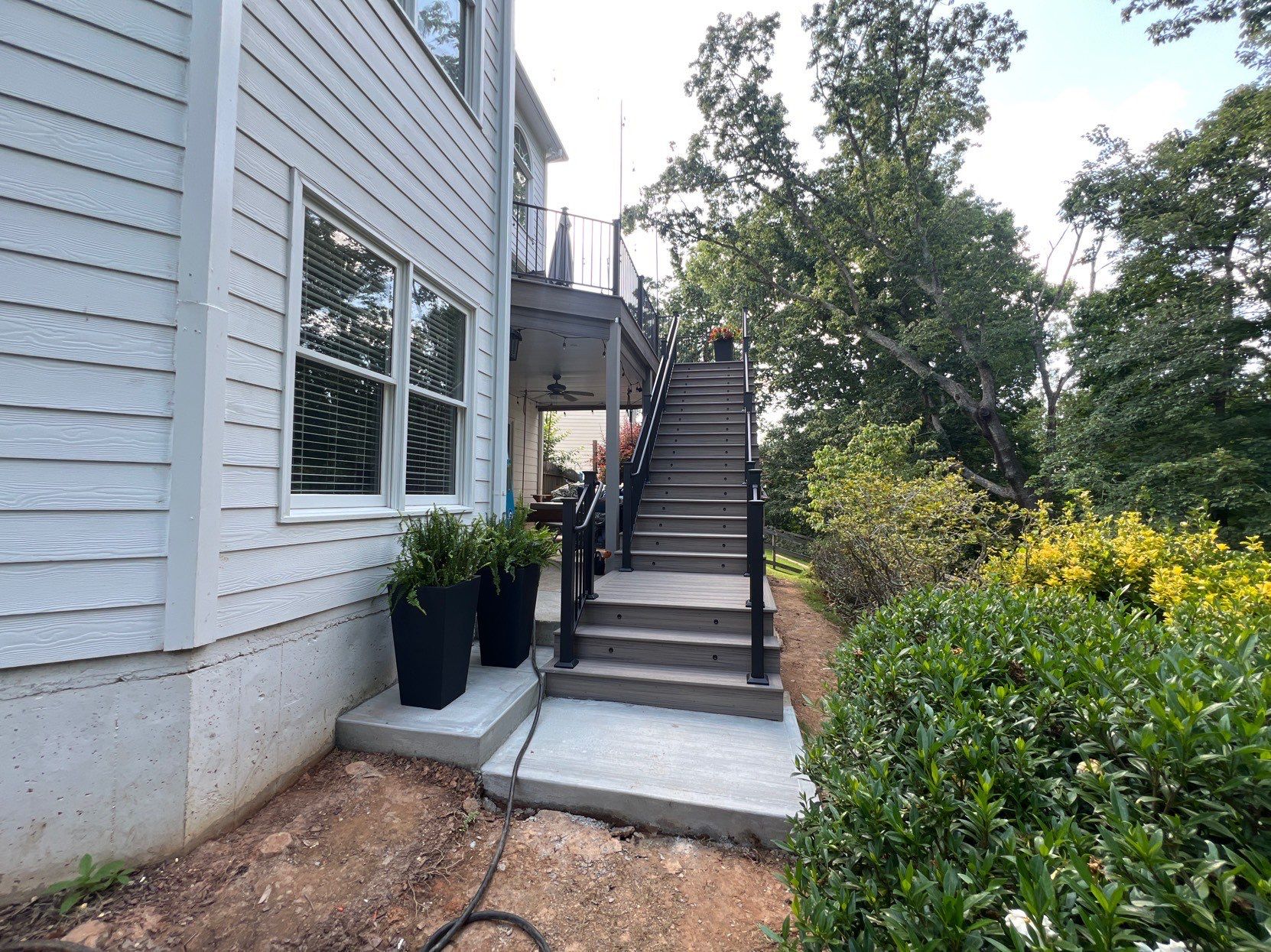 Elevated Composite Deck and Concrete Landing Installation in Kennesaw by Swift Home Renovations