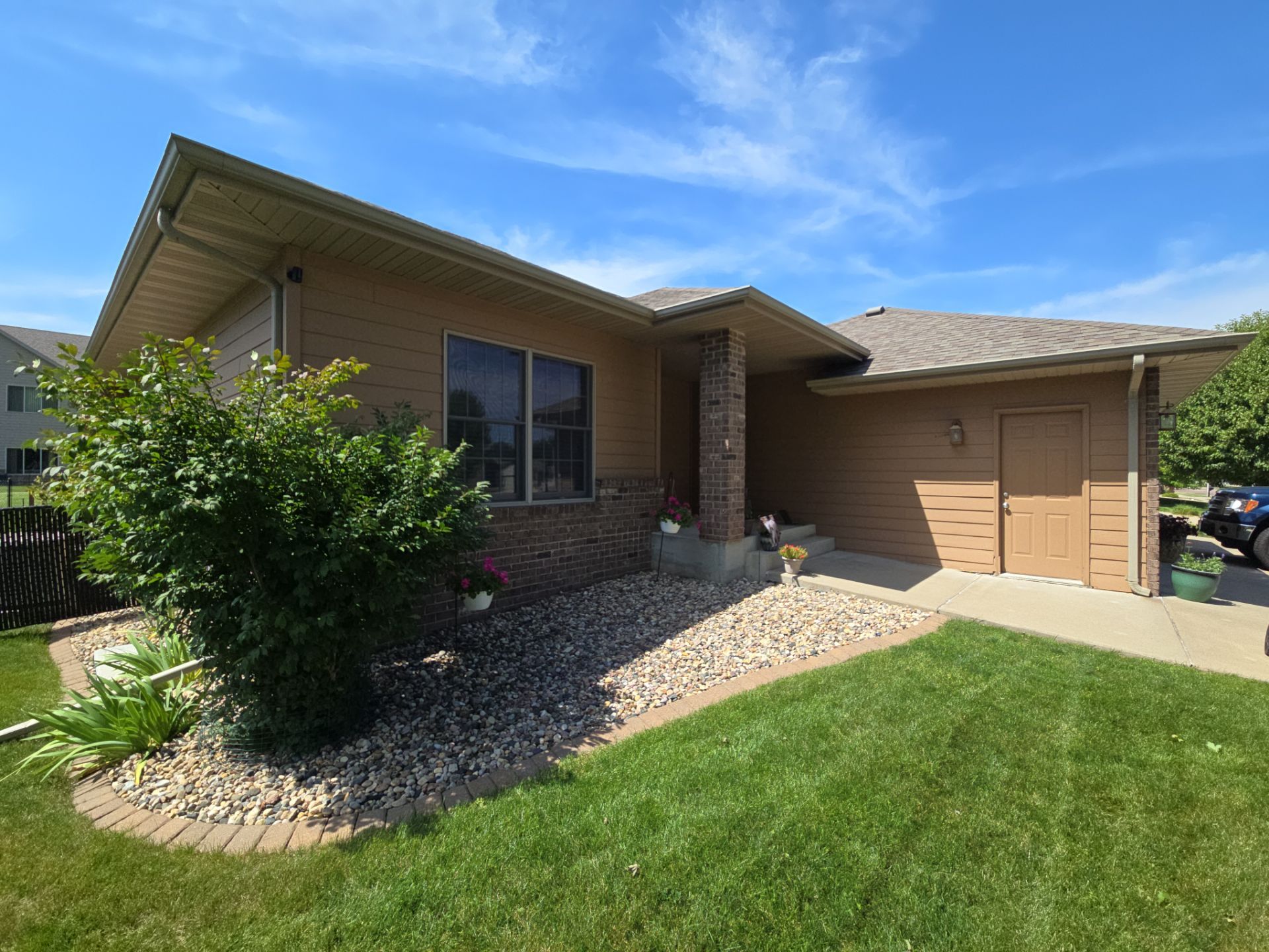 Sioux Falls Residential Exterior Door and Siding Refresh by Select Painting, Coatings & Garage Cabinets