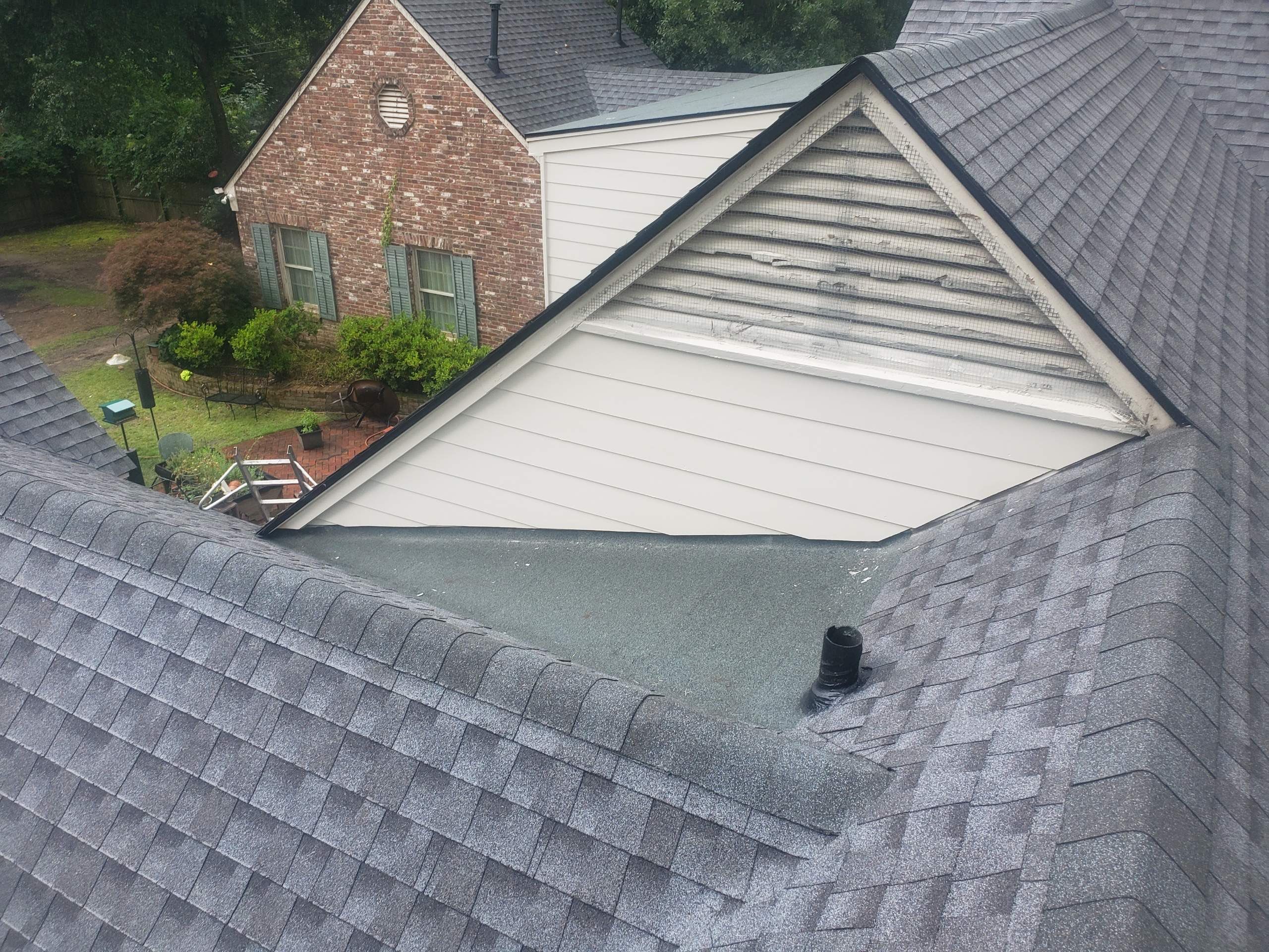 Full Roof Replacement with gutter upgrade after tree impact damage in East Memphis by Revival Roofing Services