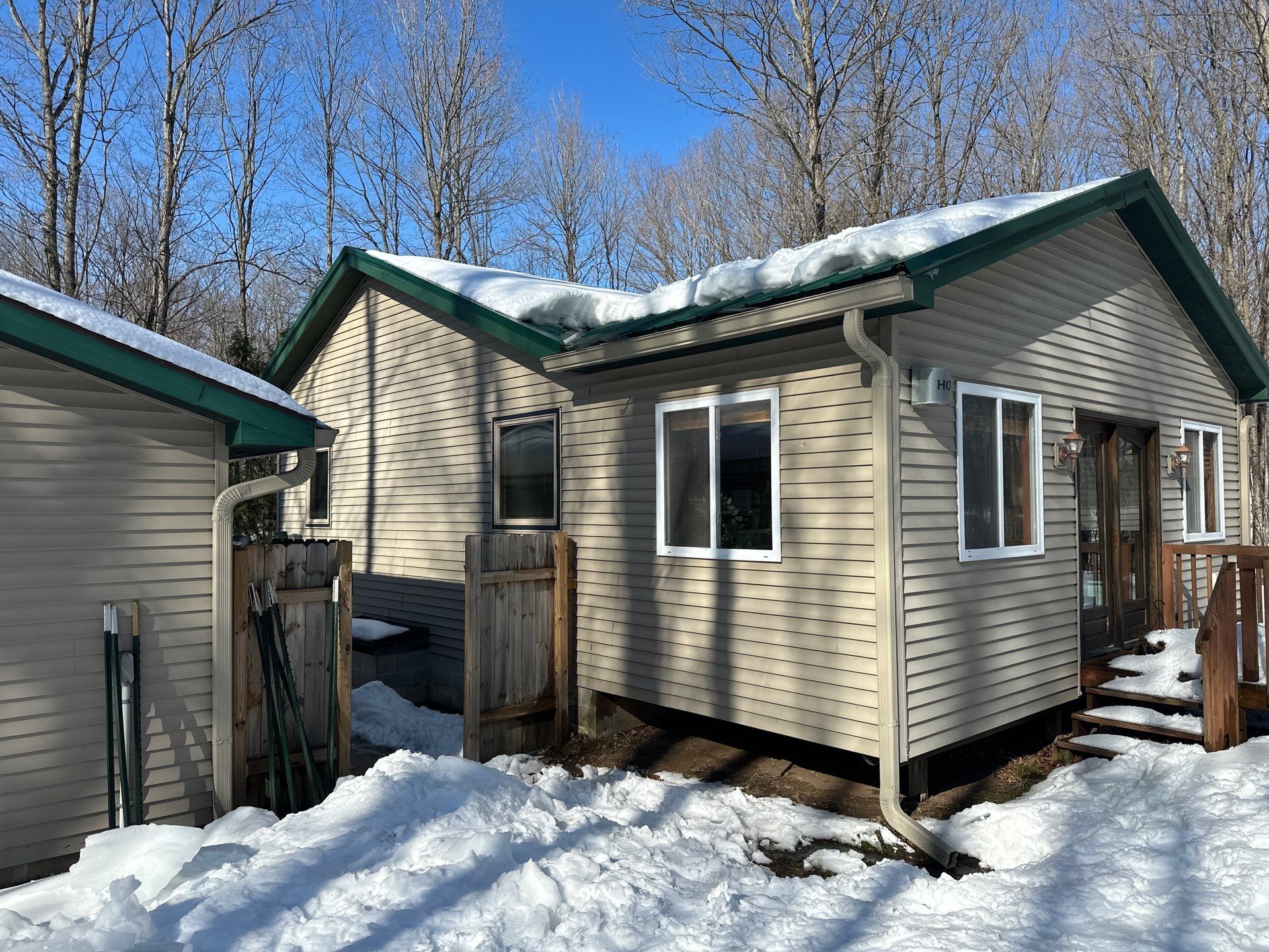 Residential Ice Dam Removal in Bellaire, MI by Rainbow Seamless Systems