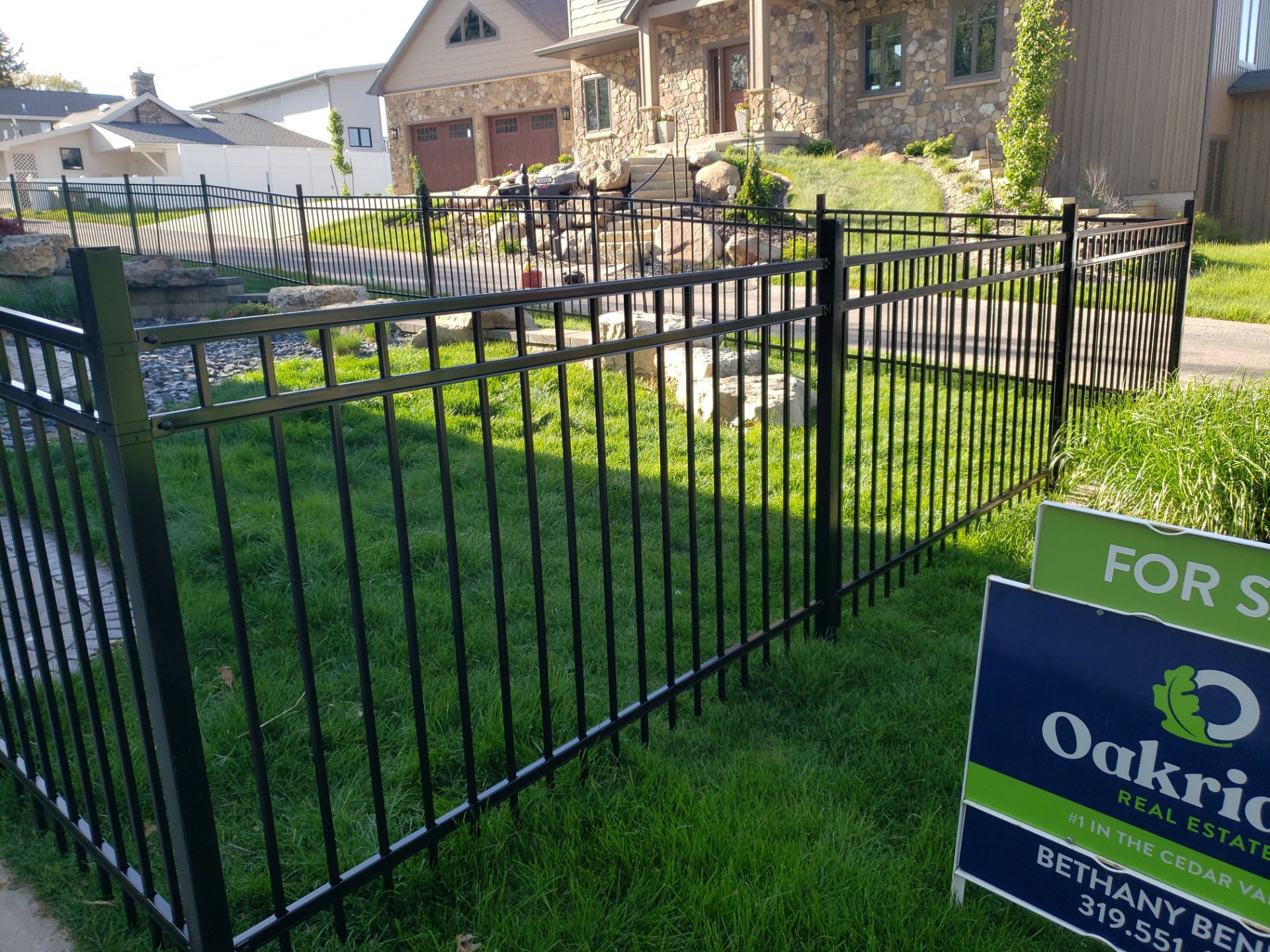 Ornamental Black Metal Picket Fence Installation in Cedar Falls by Perfect Picket Fence and Stain