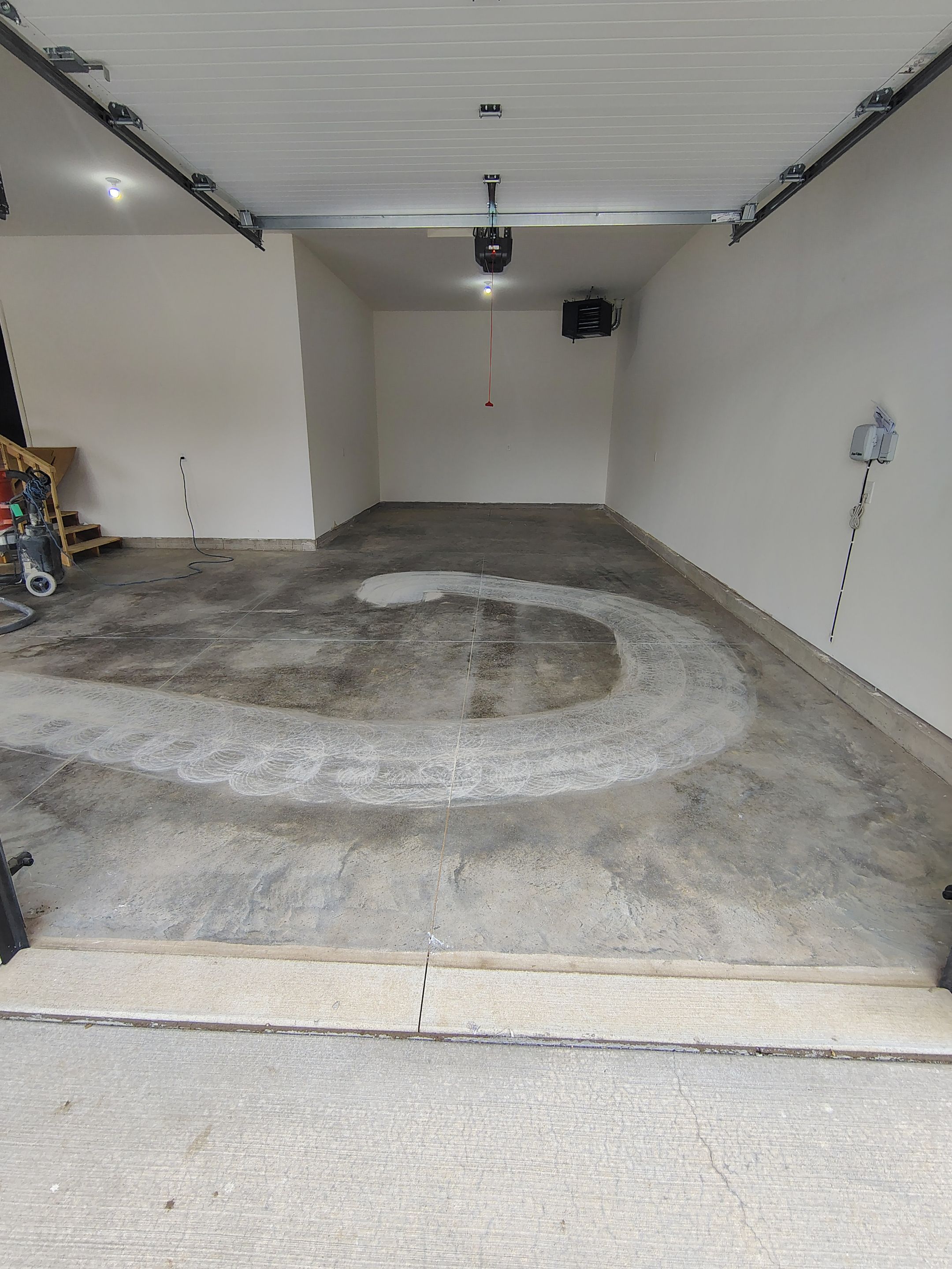 Sioux Falls Garage Floor Transformation with Gray Decorative Flake Coating by Select Painting, Coatings & Garage Cabinets