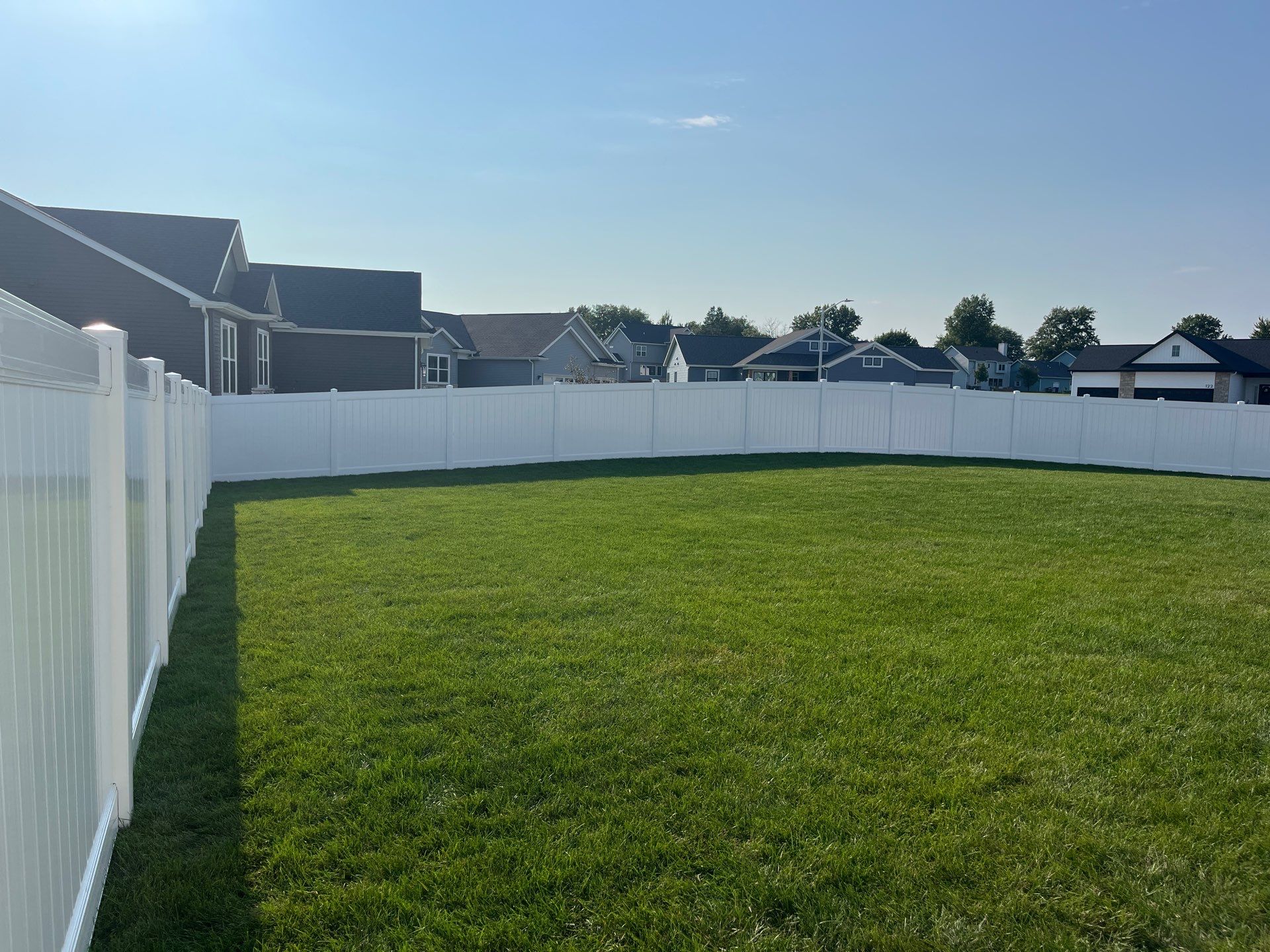 White Vinyl Privacy Fence Installation With Double Gates in Waterloo by Perfect Picket Fence and Stain