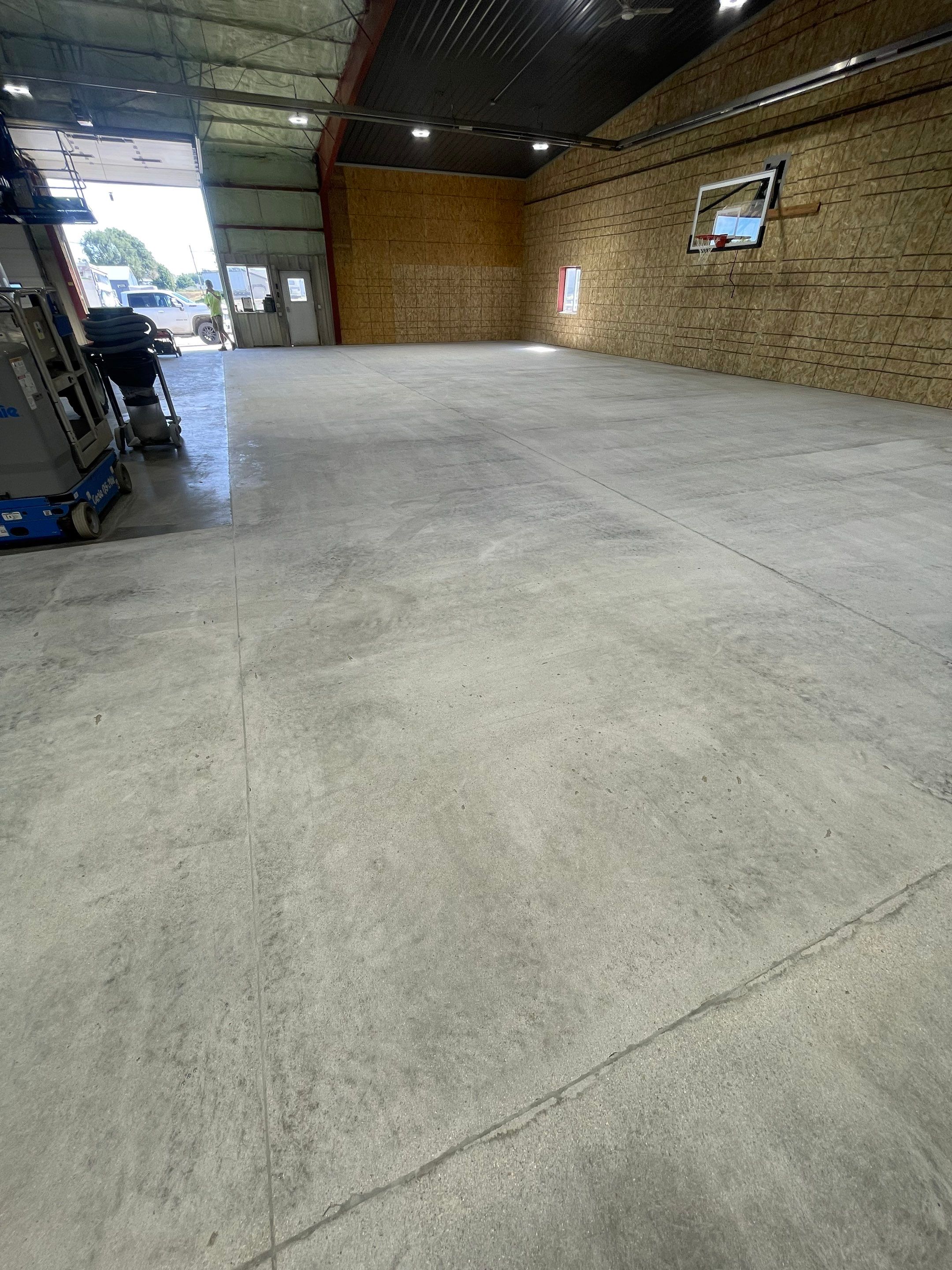 Custom Polyurea Shop Floor with Basketball Court Lines in Rock Valley by Select Painting, Coatings & Garage Cabinets