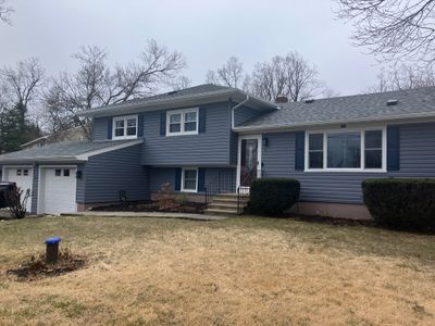 Siding transformation with Cert Monogram D/5 Dutchlap, Flagstone