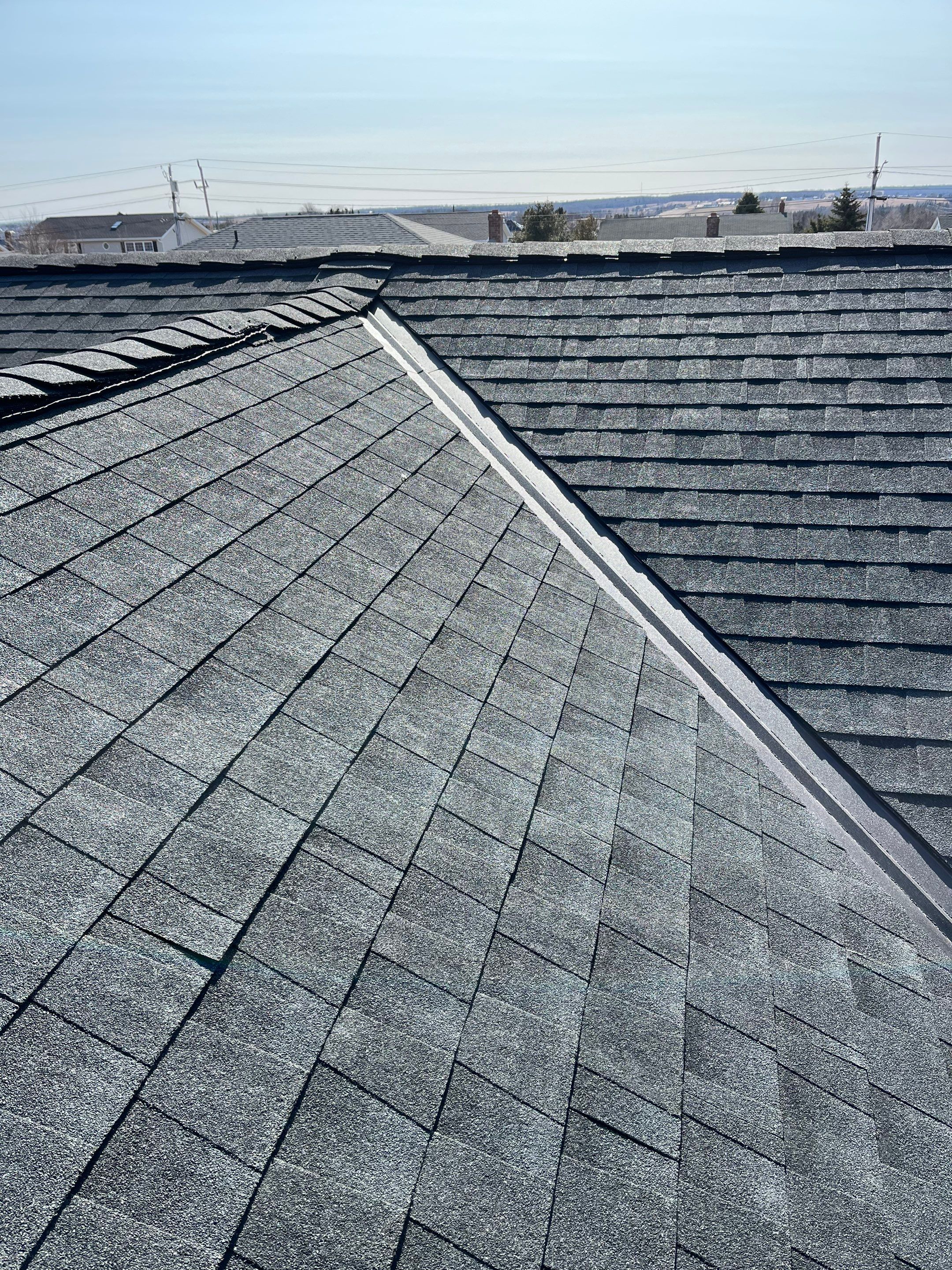 Residential Roofing Installation using Asphalt GAF HDZ in Charcoal by Artisan Roofing & Home Improvements Inc.