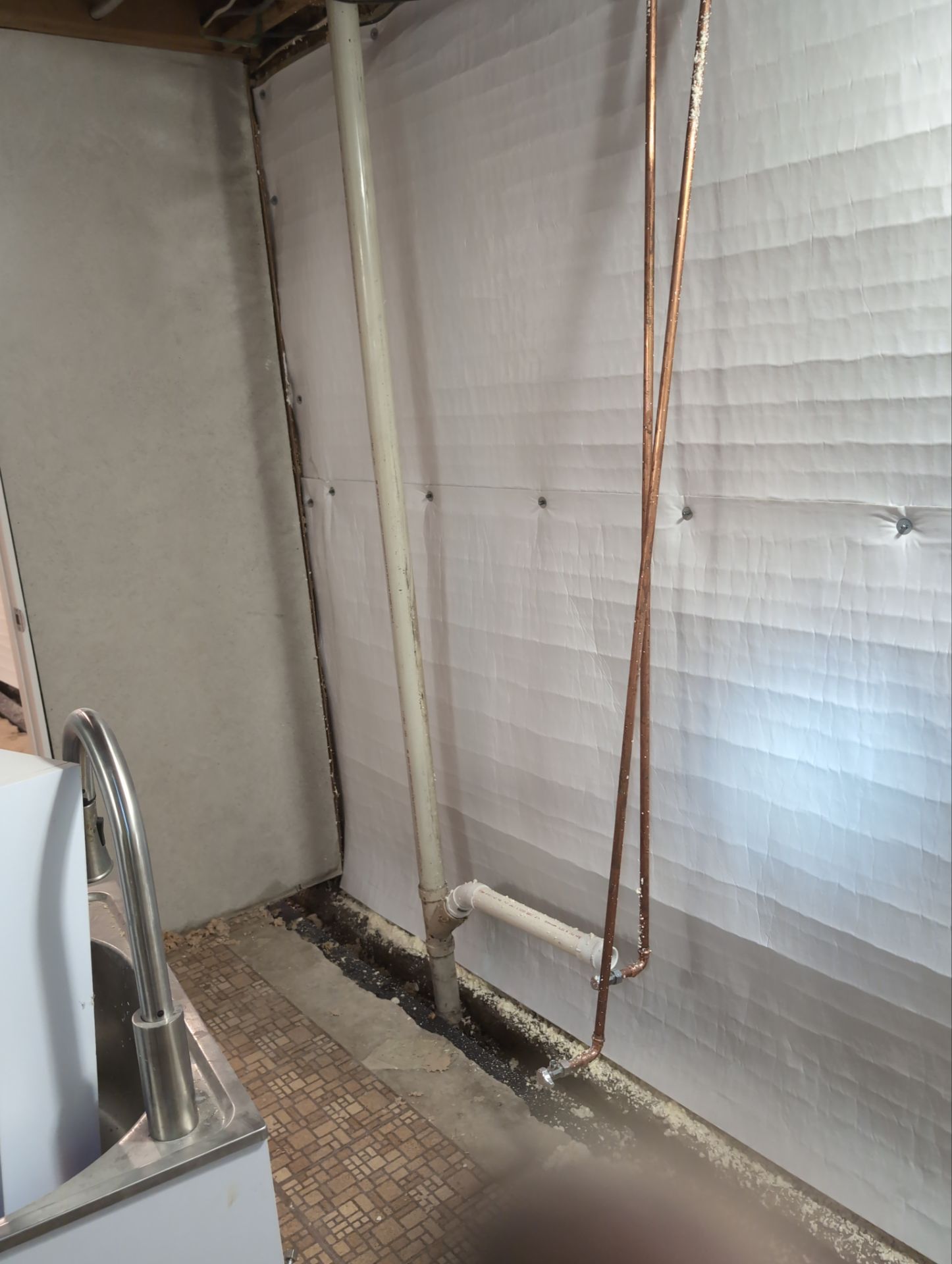 Interior Basement Waterproofing System and Egress Window Installation by Toledo Basement Repair 