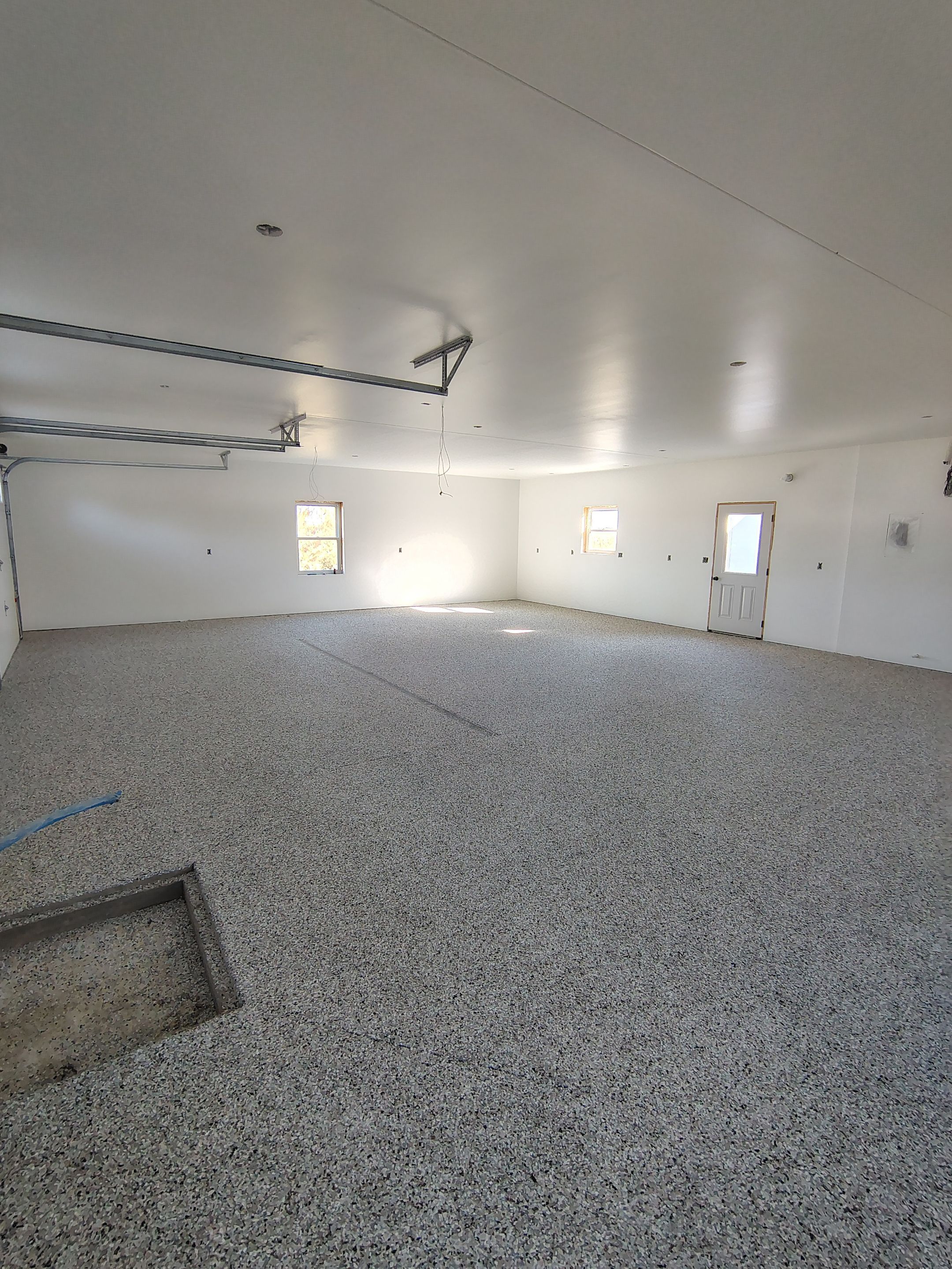 Custom Garage and Basement Epoxy Floor Coating in Menno by Select Painting, Coatings & Garage Cabinets