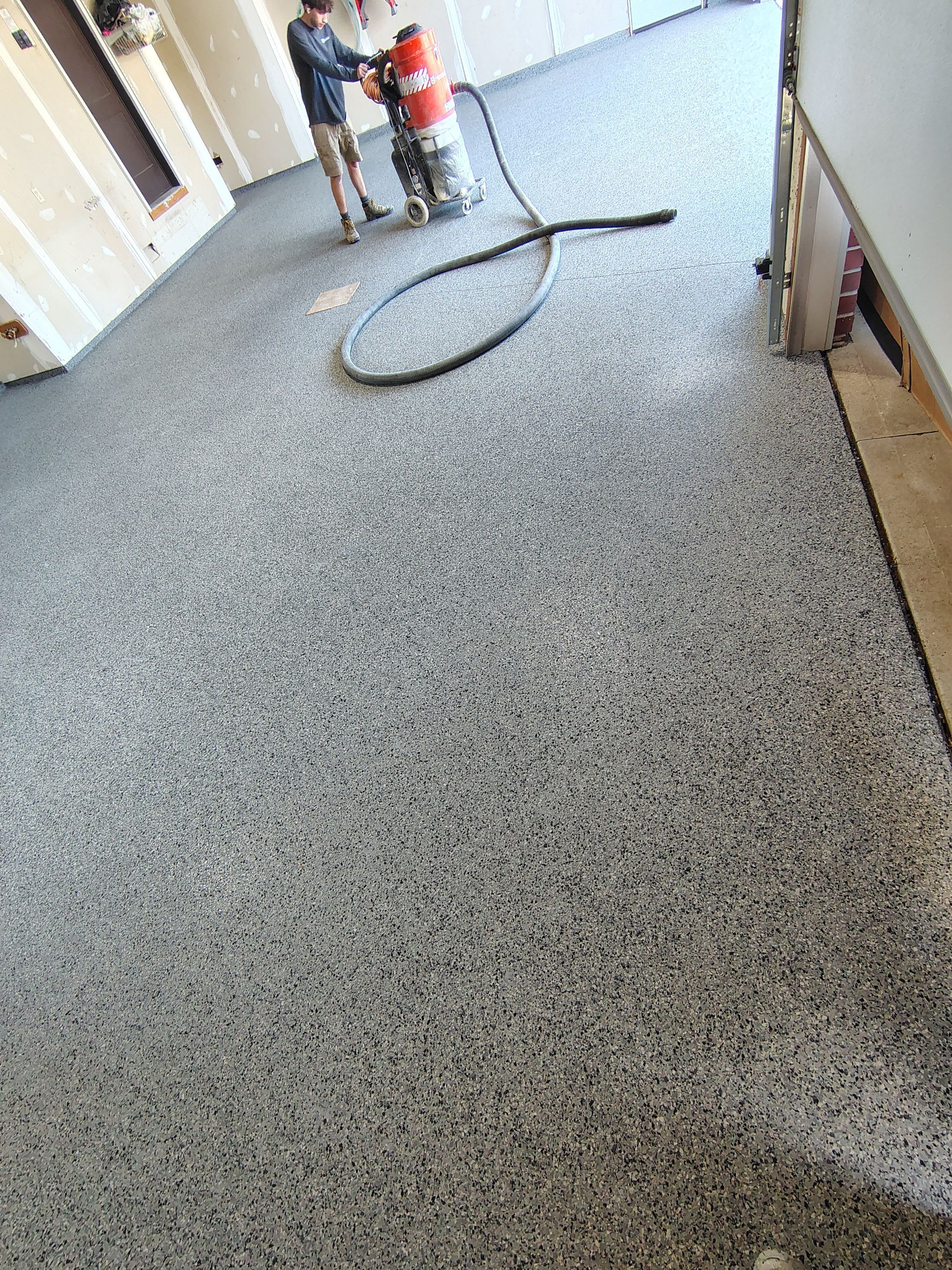 Sioux Falls Garage Concrete Grinding and Nightfall Decorative Chip Coating by Select Painting, Coatings & Garage Cabinets