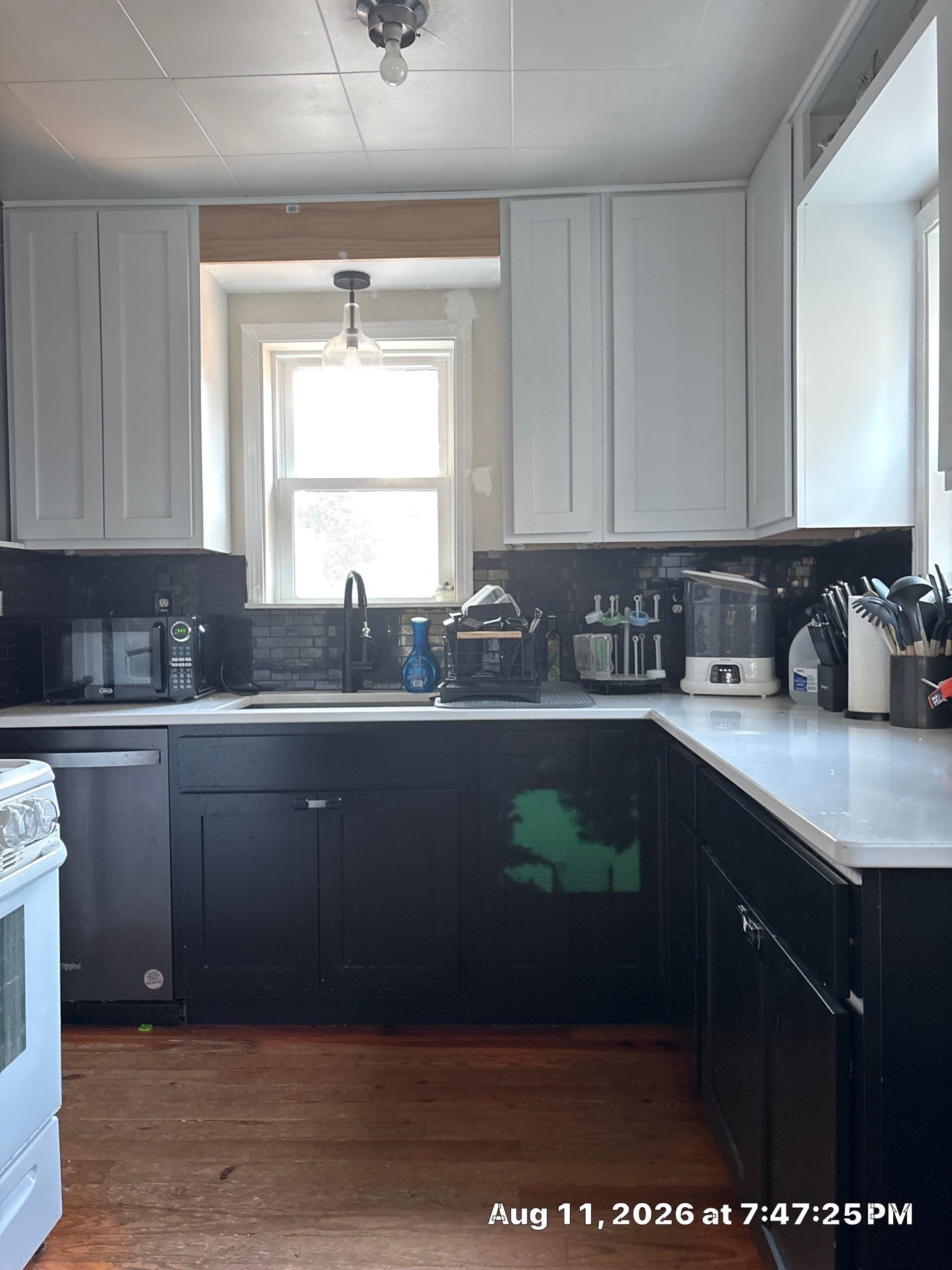 Two-Tone Kitchen Remodel with Black Subway Tile in Lincoln by CompanyCam Sales Demo