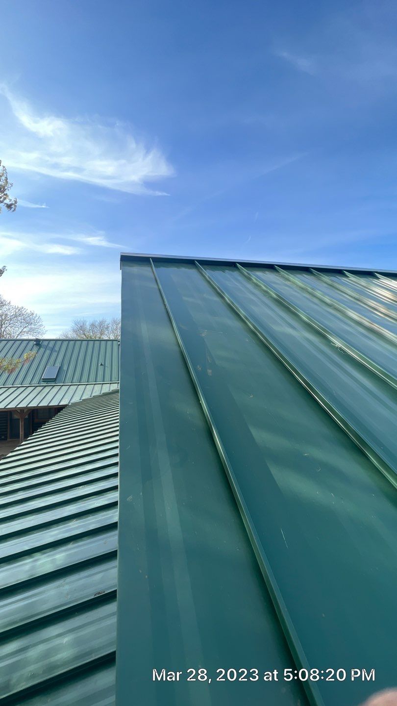 Shingle to Standing Seam Metal Roof by Springtree Restoration 