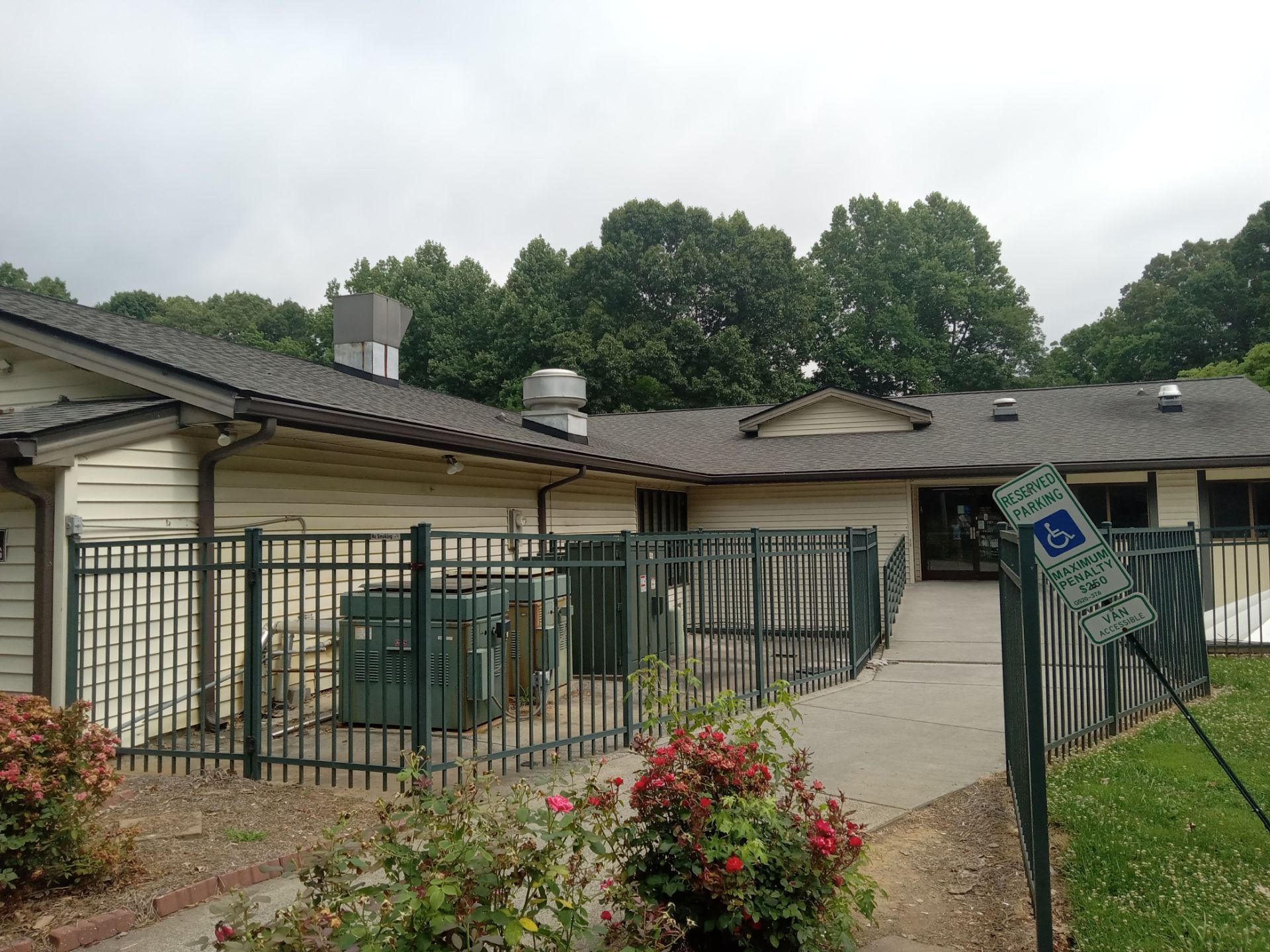 pressure washing exterior surfaces including siding walkways and a fence