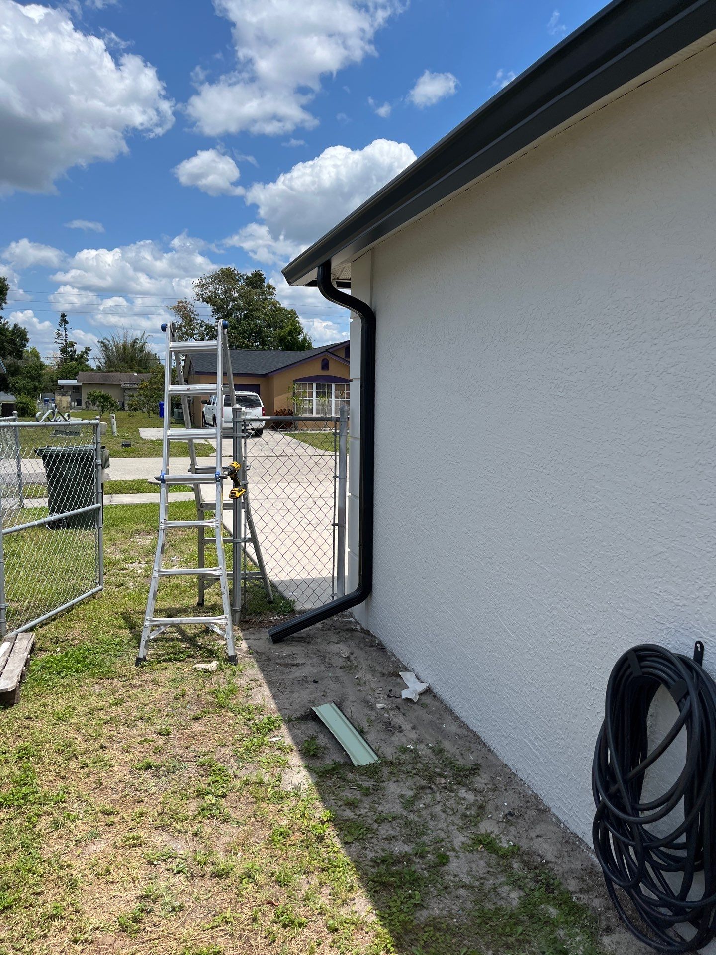 Black Seamless Gutters and Downspouts in Fort Myers FL by Gutter Professors