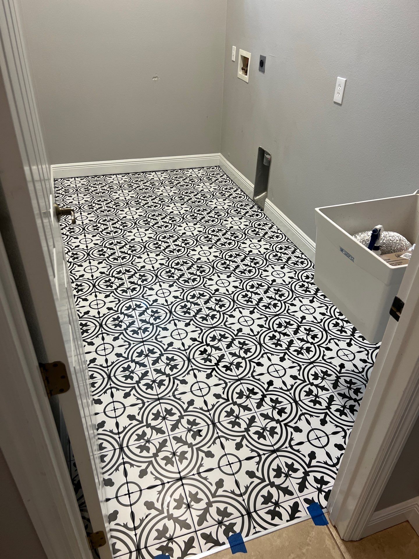 Laundry tile upgrade by Vrmmm Flooring