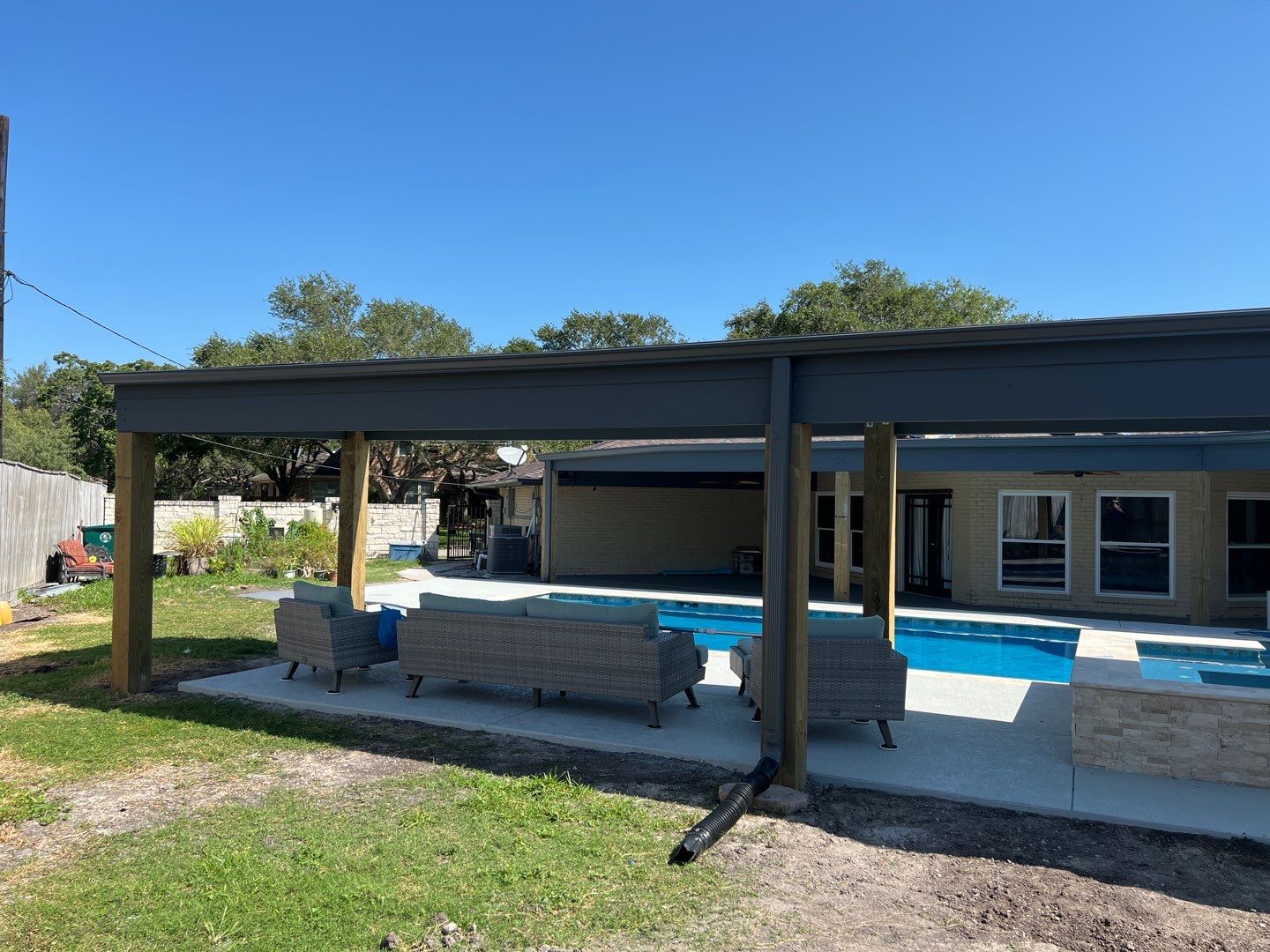 Beautiful pool side build by Bayfront Roofing and Construction