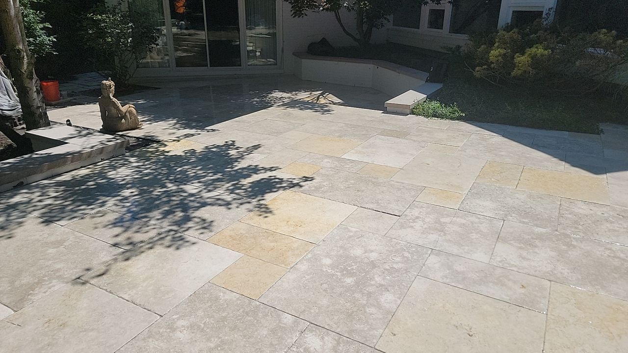 marble patio cleaning and sanding using Polysweep polymeric sand by Northern Power Washing LLC.