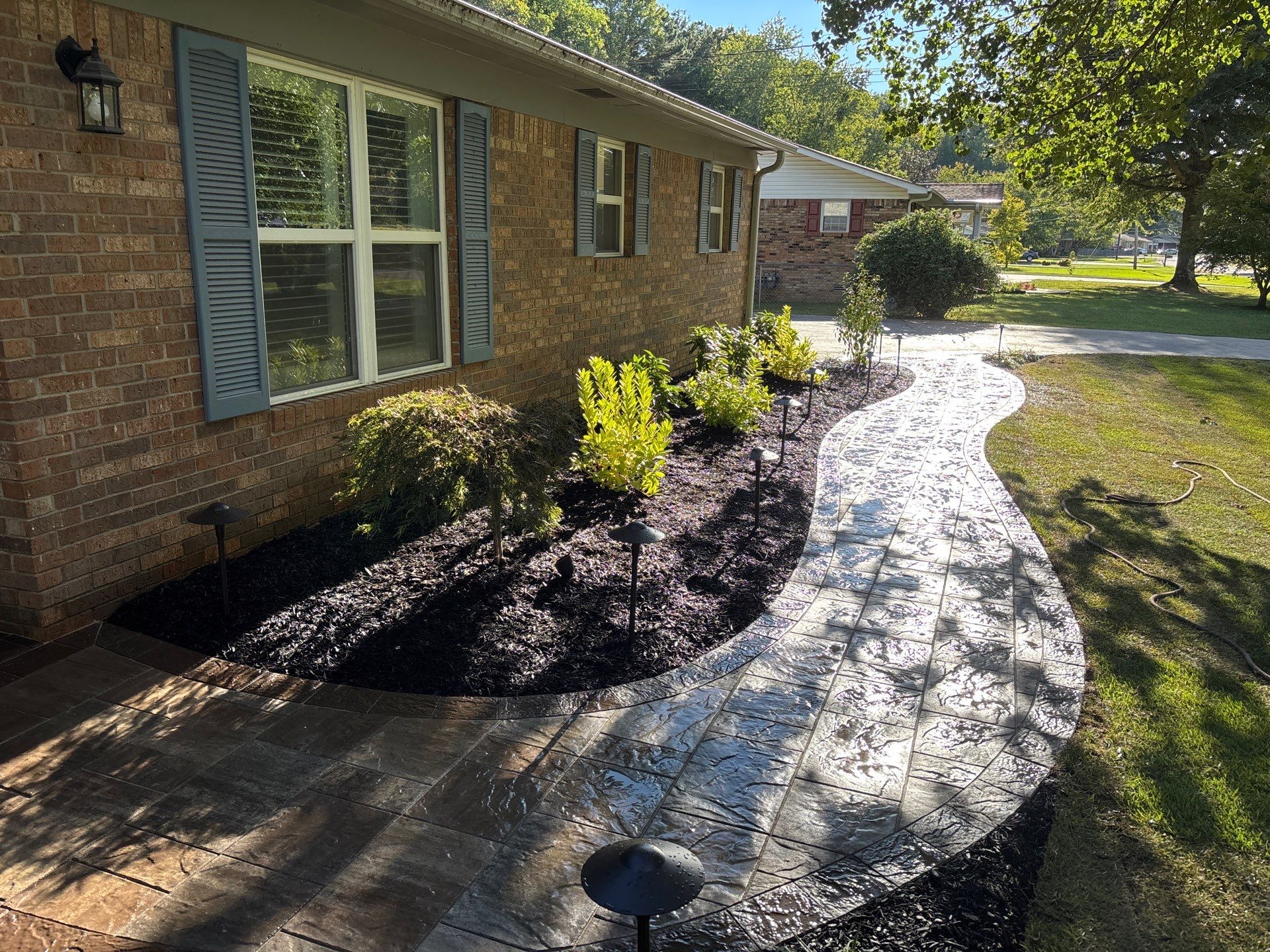 Front Entry Enhancements and a Back Deck Upgrade by Elite Proscapes LLC