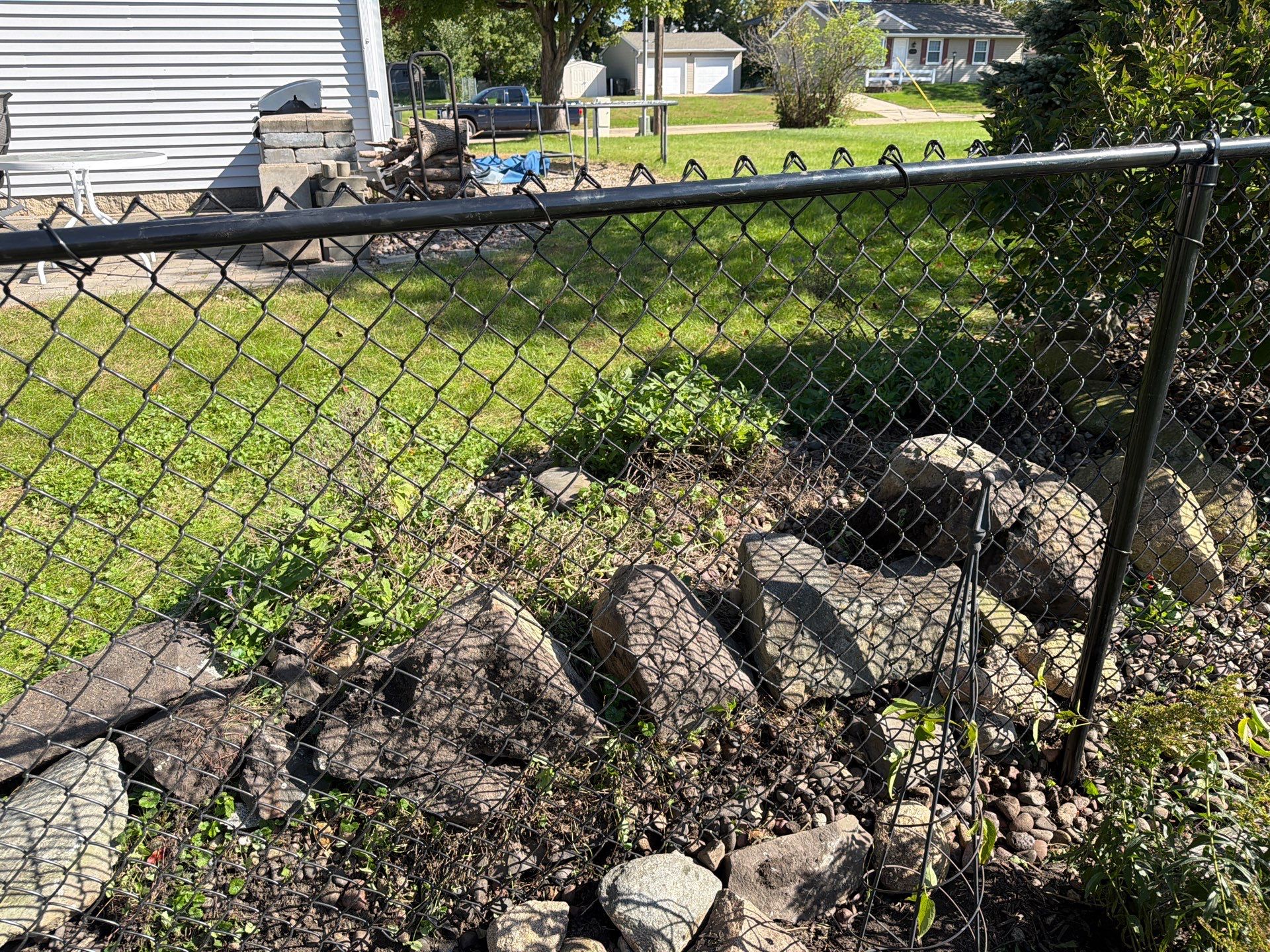 Custom Vinyl Privacy and Black Chain Link Fence Installation in Cedar Falls by Perfect Picket Fence and Stain