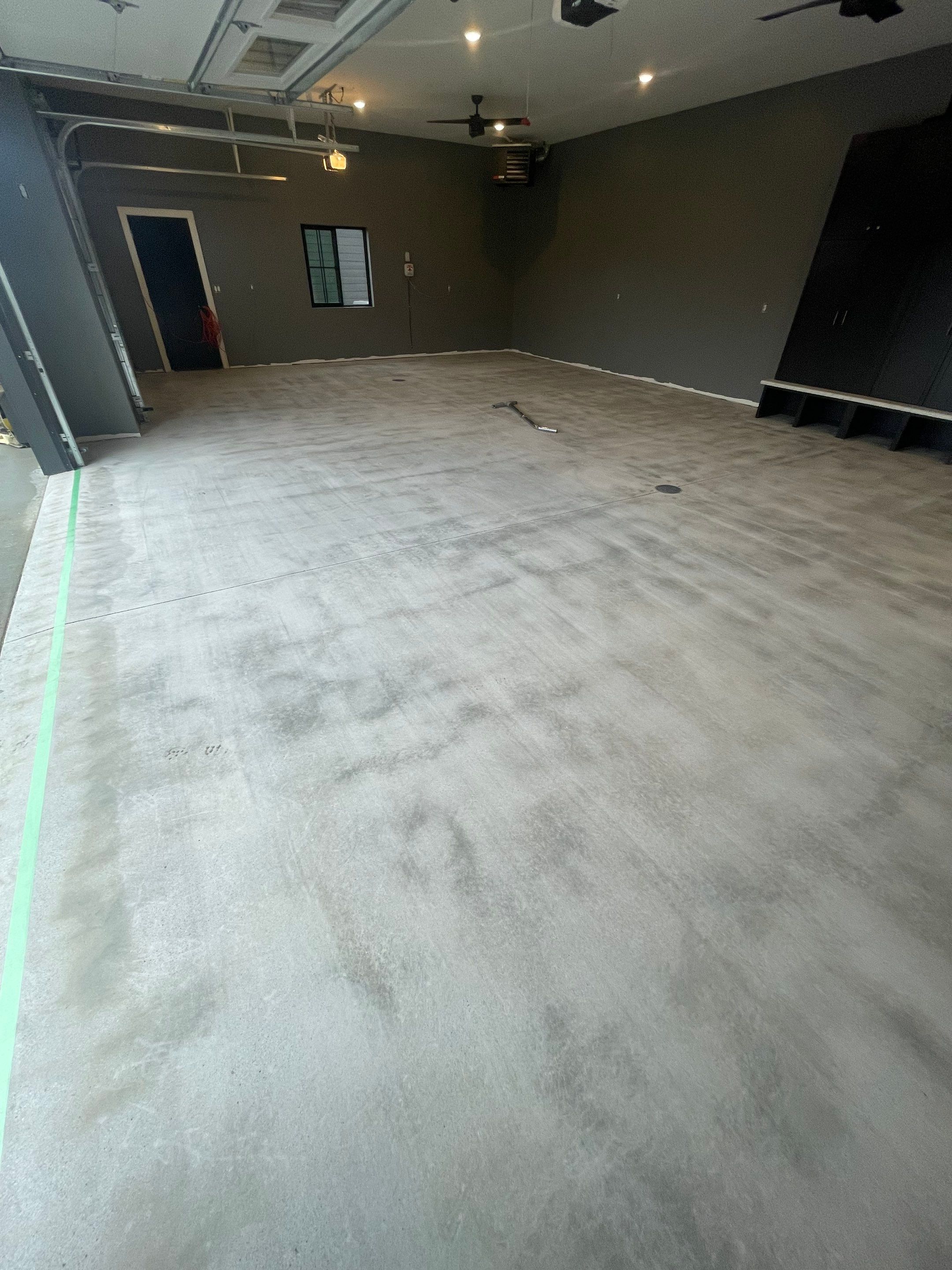 Custom Speckled Concrete Coating for Dell Rapids Garage by Select Painting, Coatings & Garage Cabinets