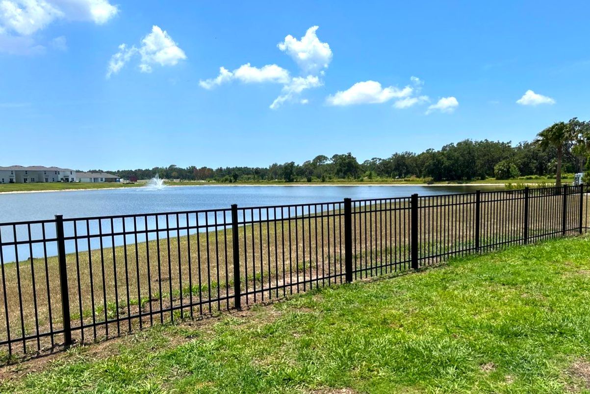 Aluminum Fence Installation using Black 3 Rail Aluminum Fence and Tan Vinyl Privacy Fence by Asap fence and gates, LLC