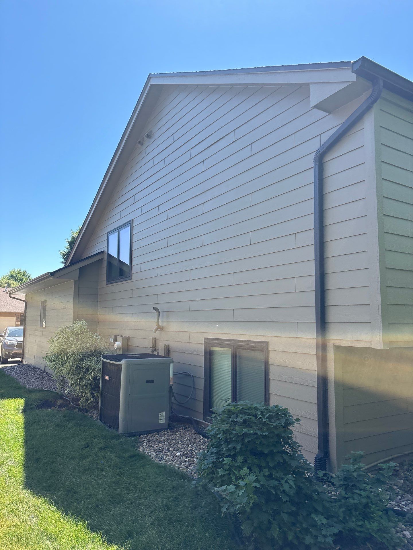 Residential Exterior Painting and Trim Restoration in Sioux Falls by Select Painting, Coatings & Garage Cabinets