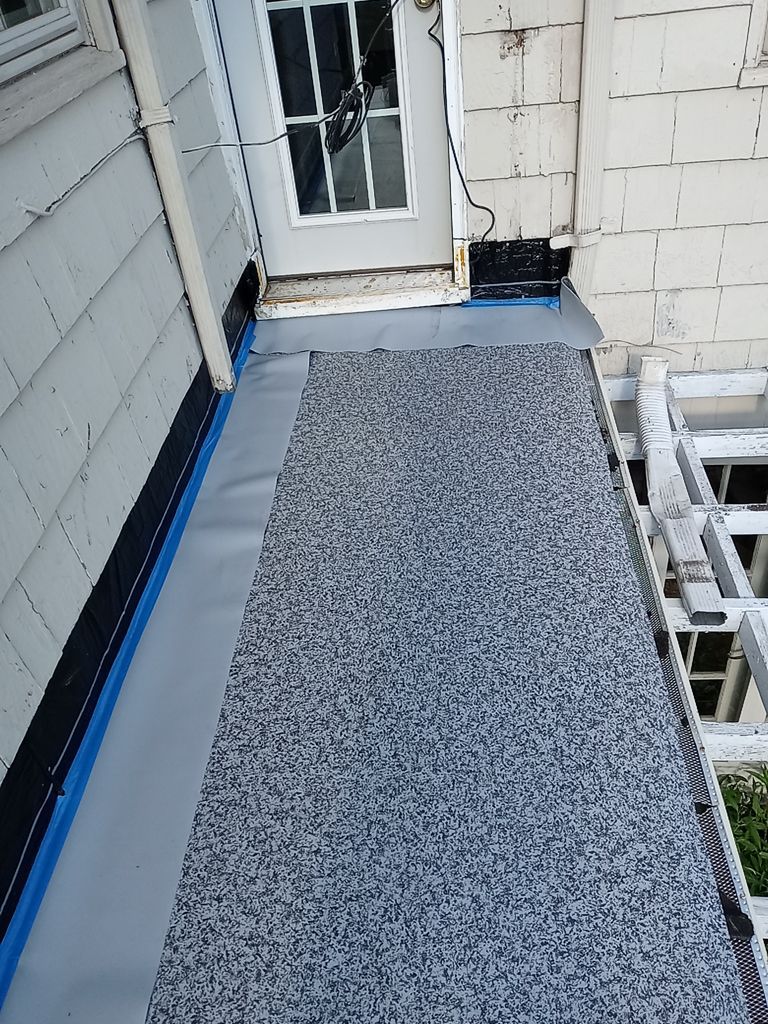 Residential Roofing Installation, Dec-tek walk-out porch roof, siding on garage by Absolute Roofing and Construction
