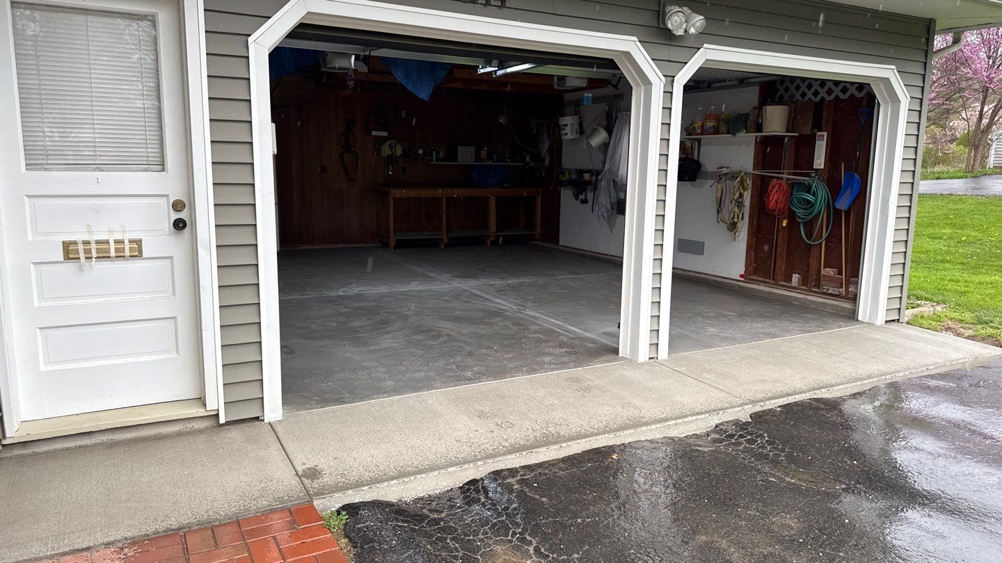Concrete garage floor replacement with a broom finished apron by NG Masonry & Construction LLC