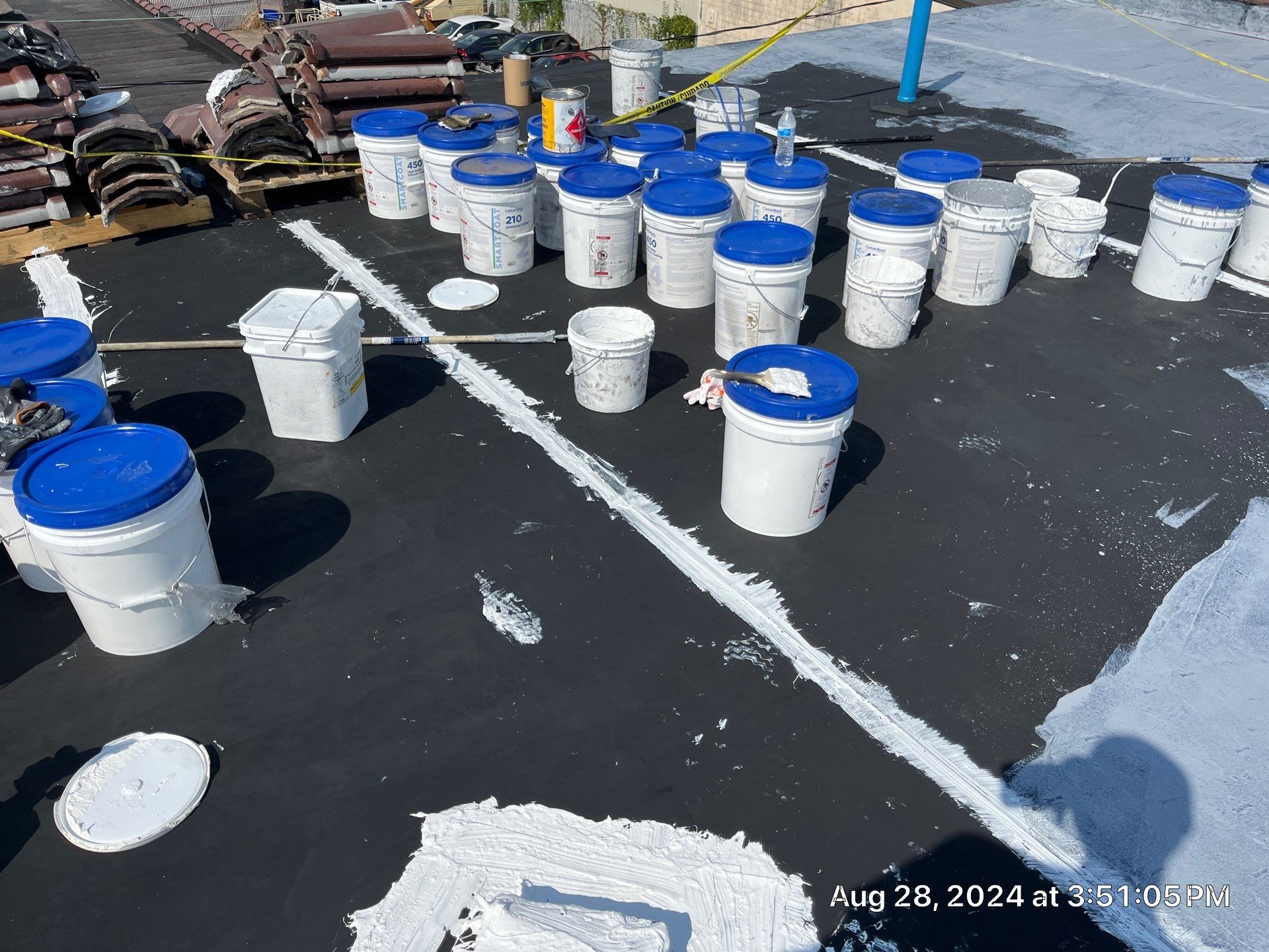 Commercial Roofing Installation using smartcoat Roof coating by Fahey Roofing + Contracting