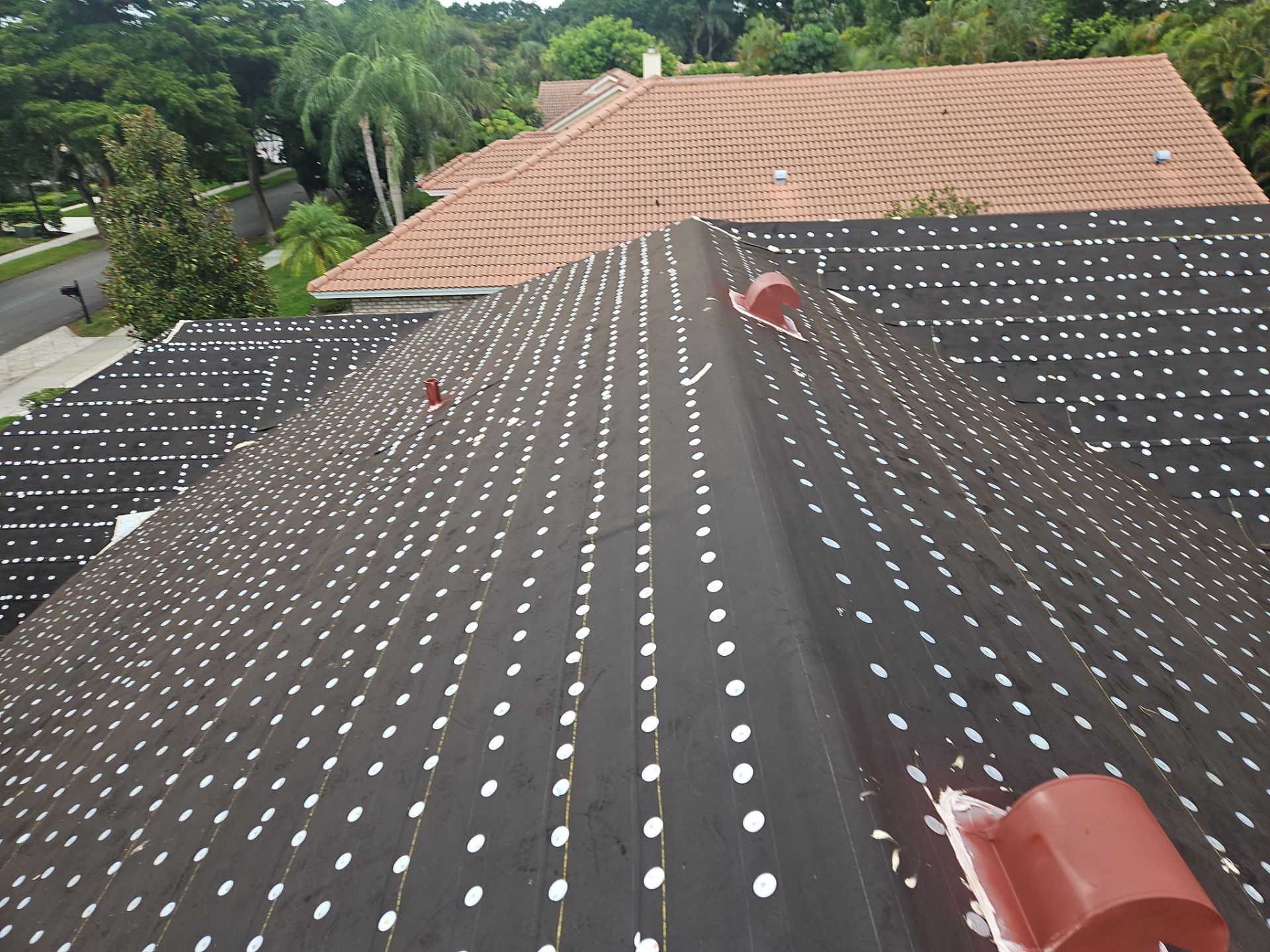 Residential Roofing Installation using 1" Nail strip metal roof by BLUES BROTHERS ROOFING