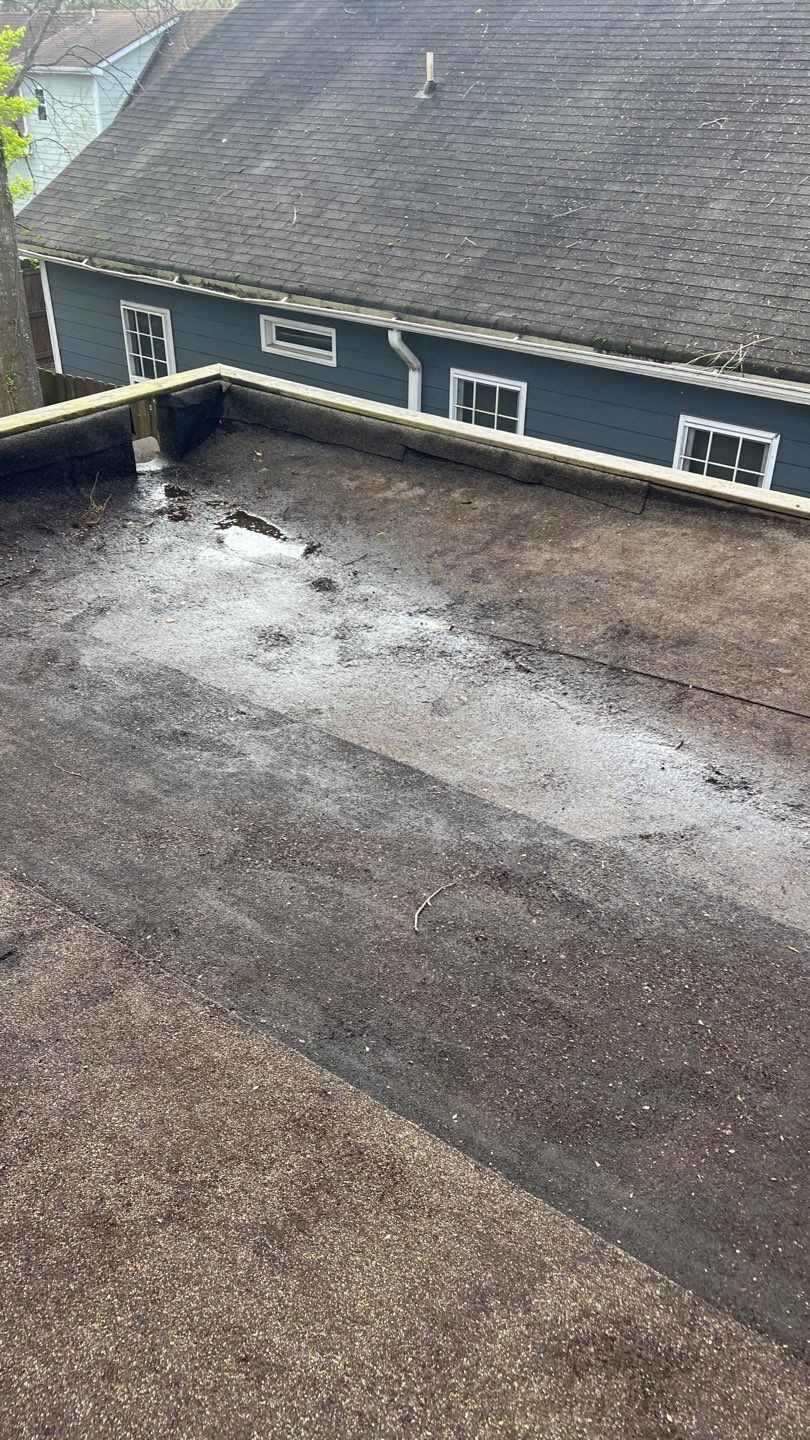 Gutter Cleaning using brown bags by Roof Bullies