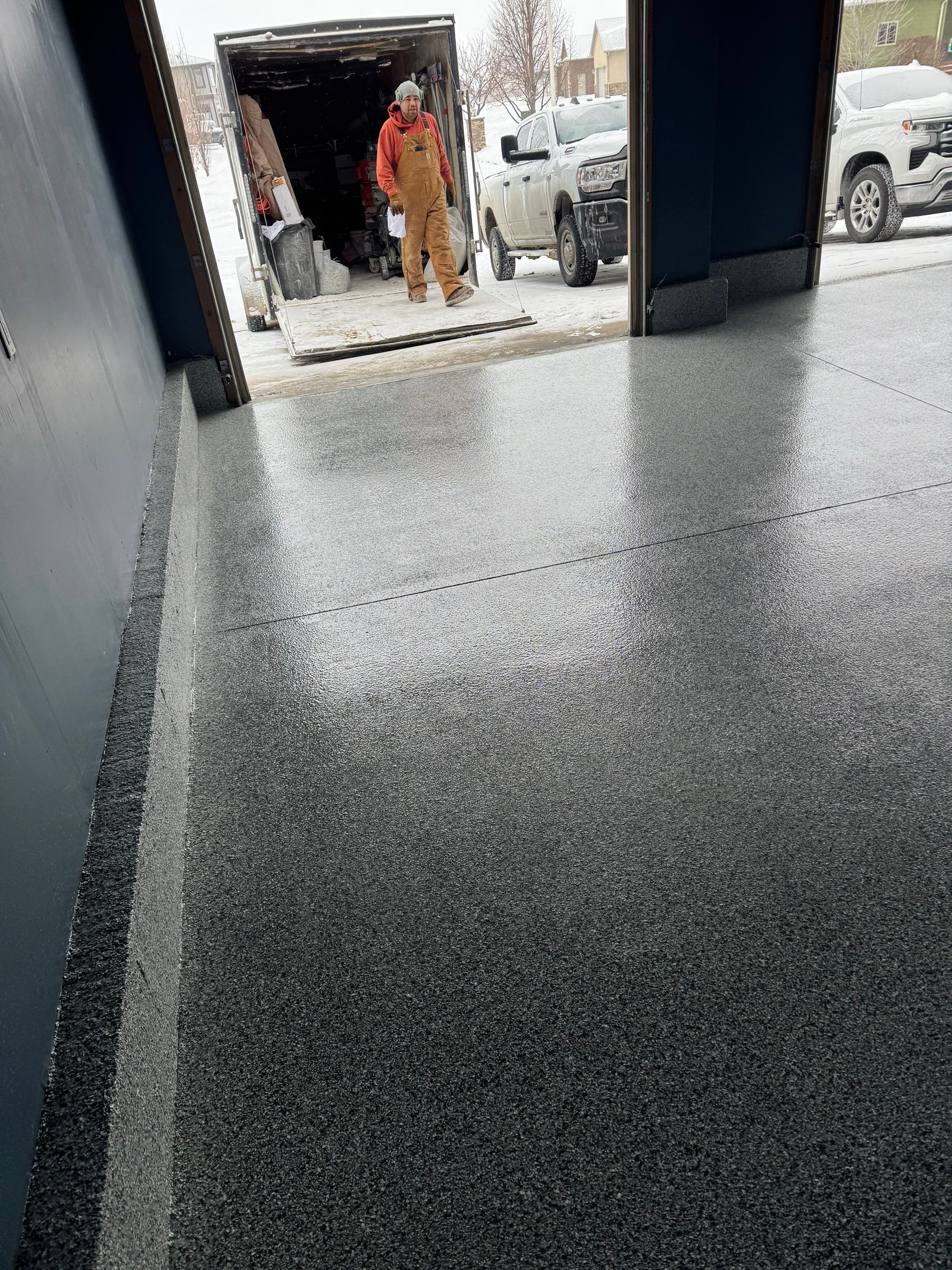 Grey Speckled Epoxy Garage Floor and Stair Coating in Sioux Falls by Select Painting, Coatings & Garage Cabinets