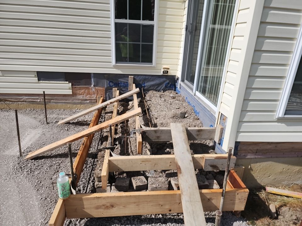 Stamped Concrete, Entry Door, and Concrete  by Ivy Lea Construction