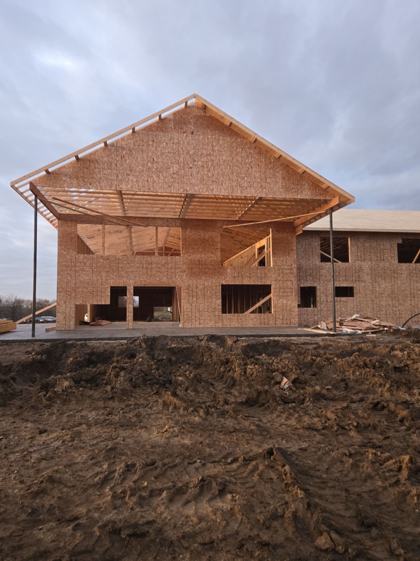 New Home construction w/ board and batten sides and metal roof  by Miles Construction 