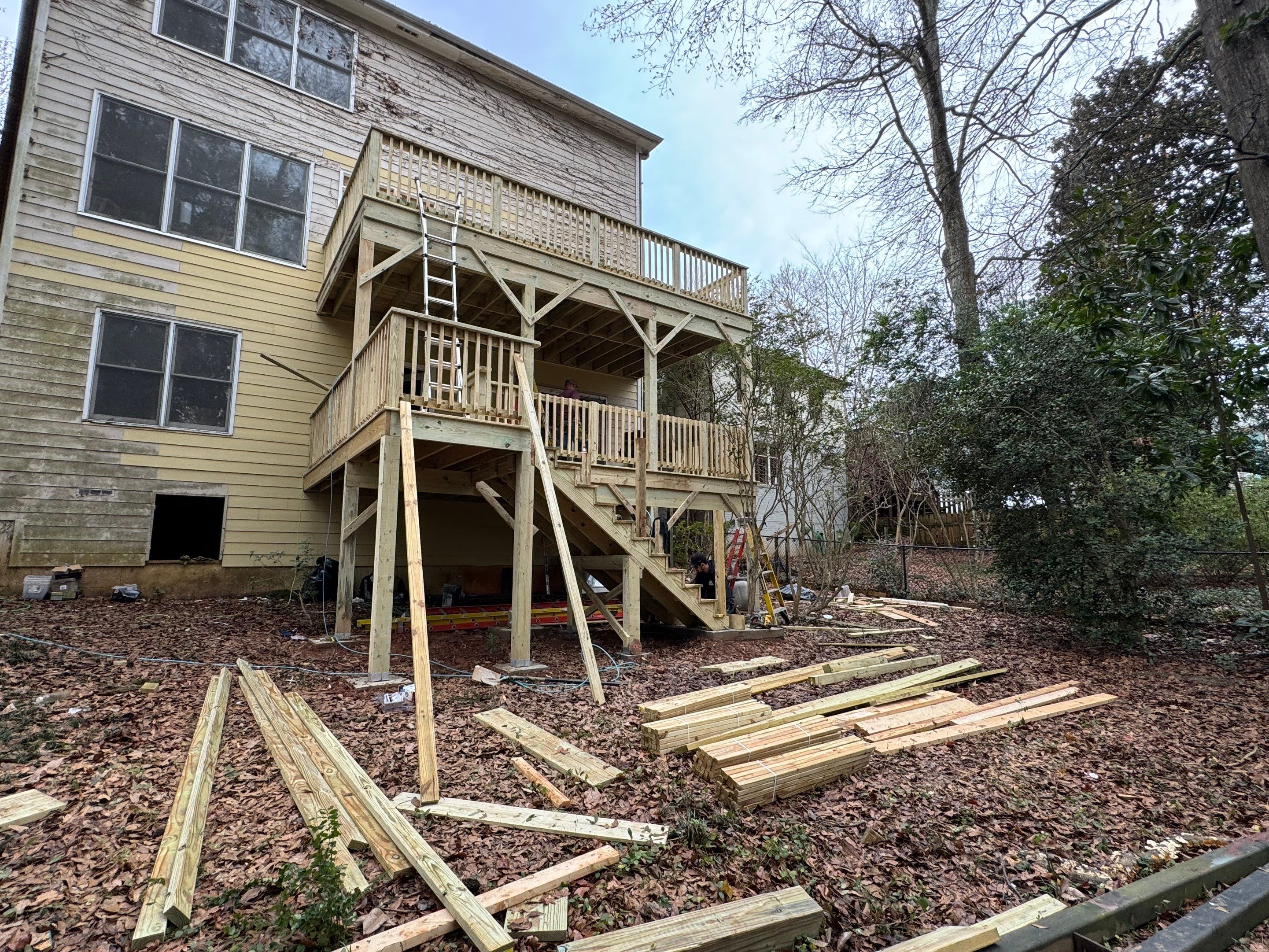 Multi-Level Pressure-Treated Wooden Deck Construction in Decatur by Swift Home Renovations