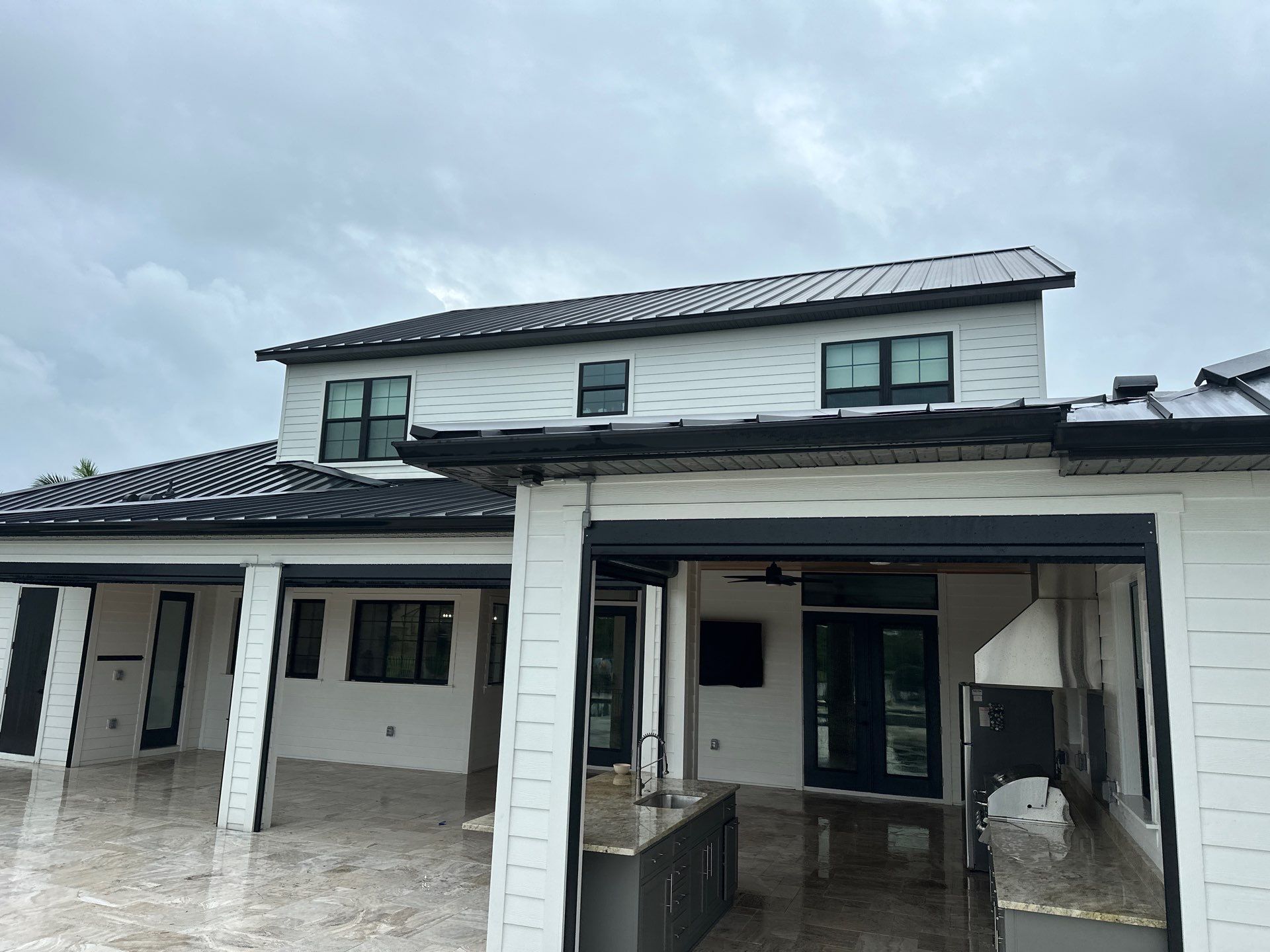 Complete Two-Story House Wash and Driveway Cleaning in Winding River Community, Bradenton, FL by Sunshine AquaWash