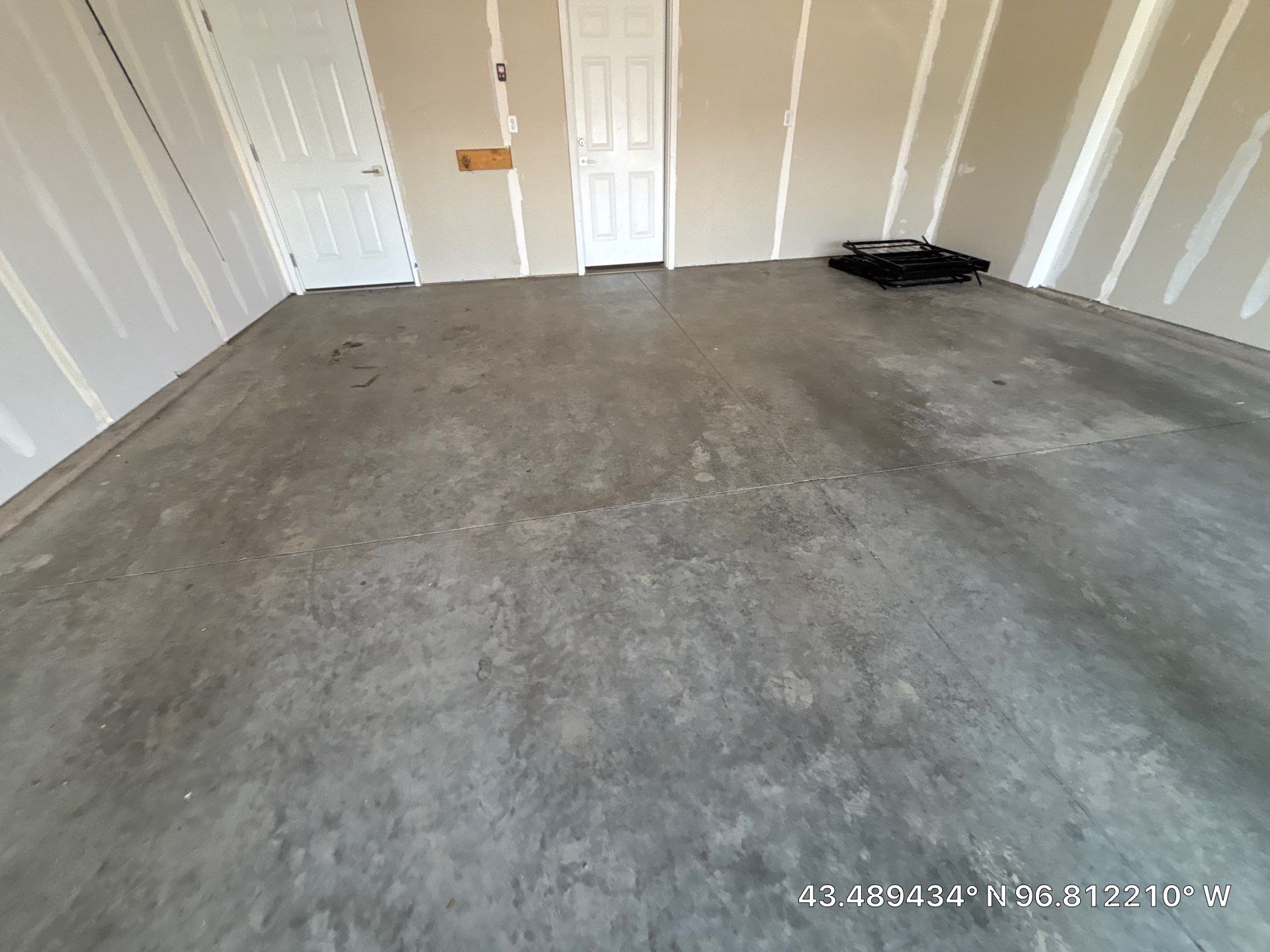 Custom Epoxy Garage Floor and Patio Coating in Sioux Falls by Select Painting, Coatings & Garage Cabinets