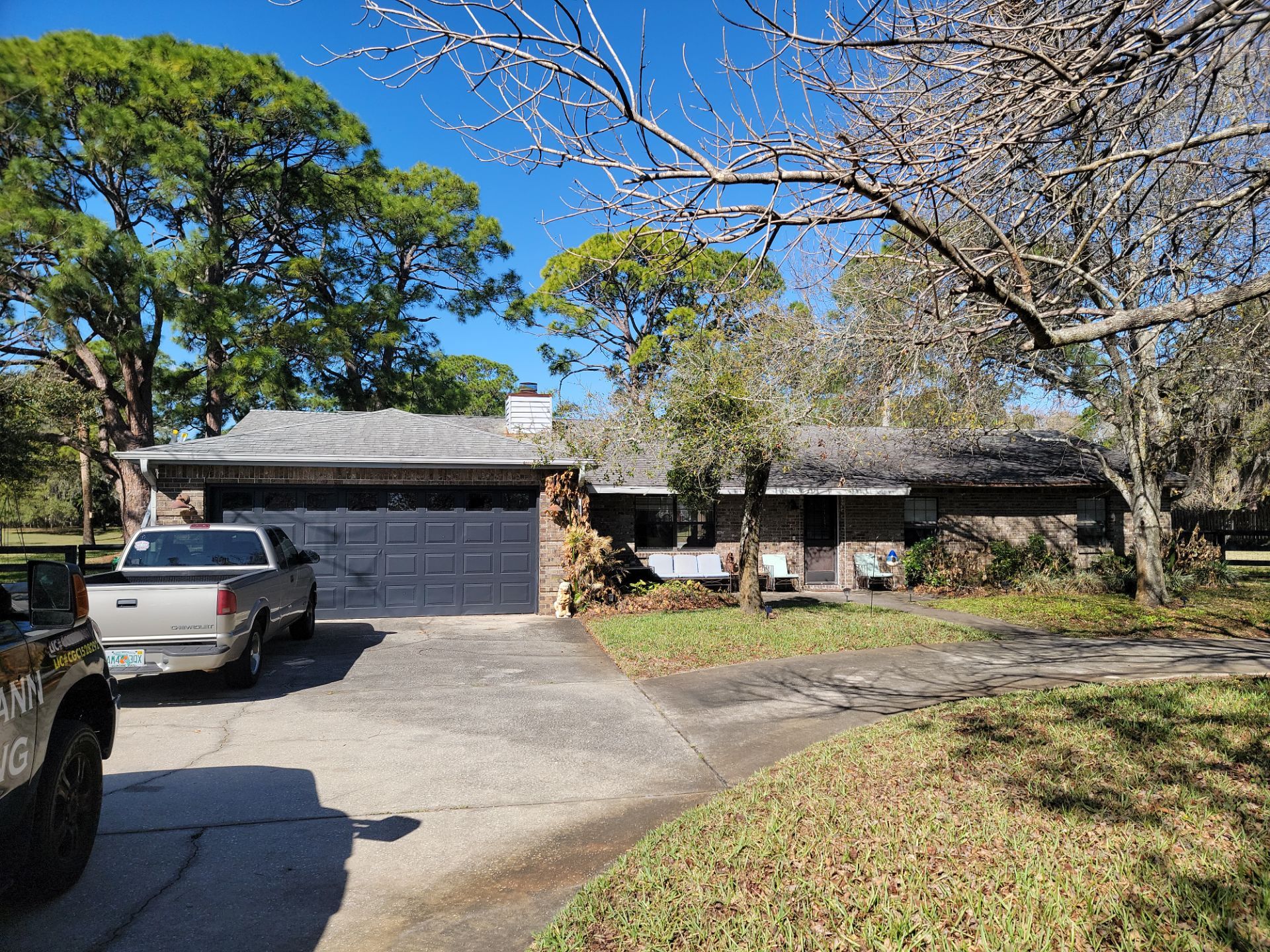 Roof Replacement with Architectural Shingles and Chimney Repair in Cocoa by Wiedmann Construction & Roofing