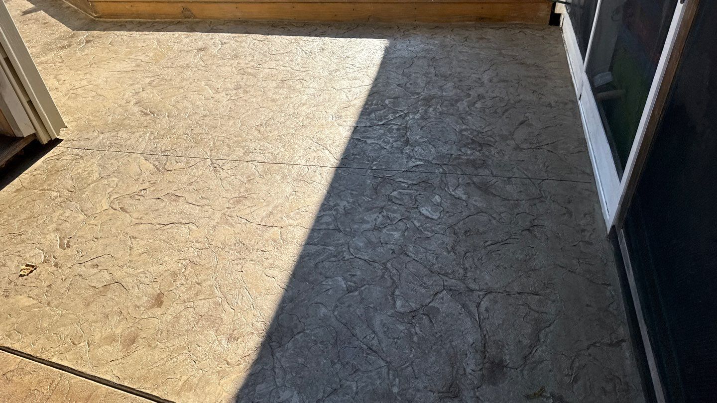 Oxford slate stamped patio  by NG Masonry & Construction LLC