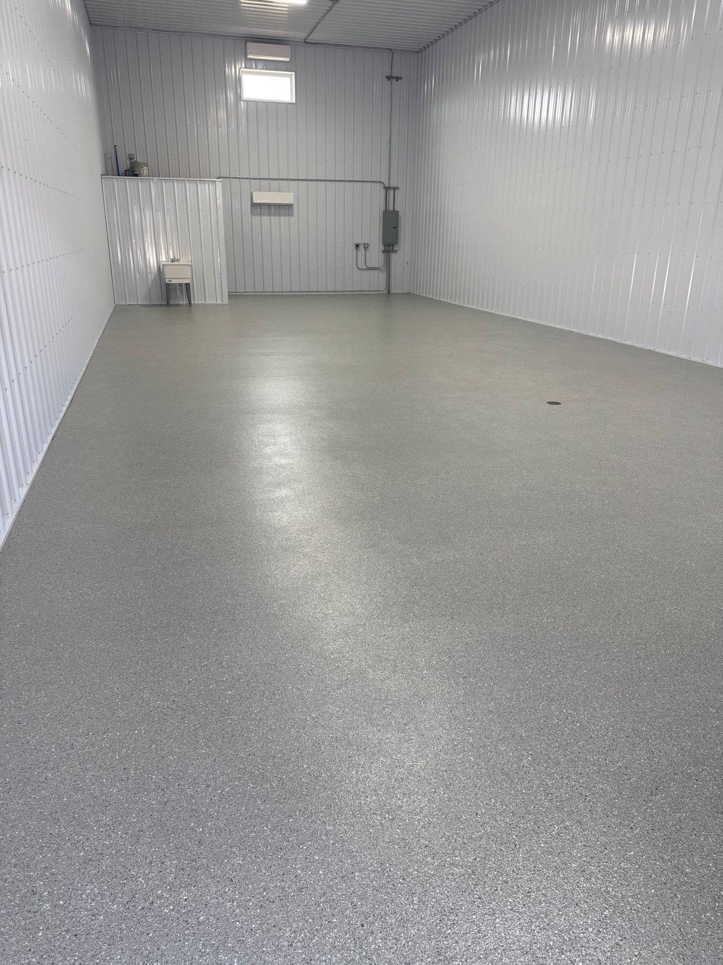 Commercial Storage Bay Epoxy Flake Floor Installation in North Muskegon by Gordon Painting